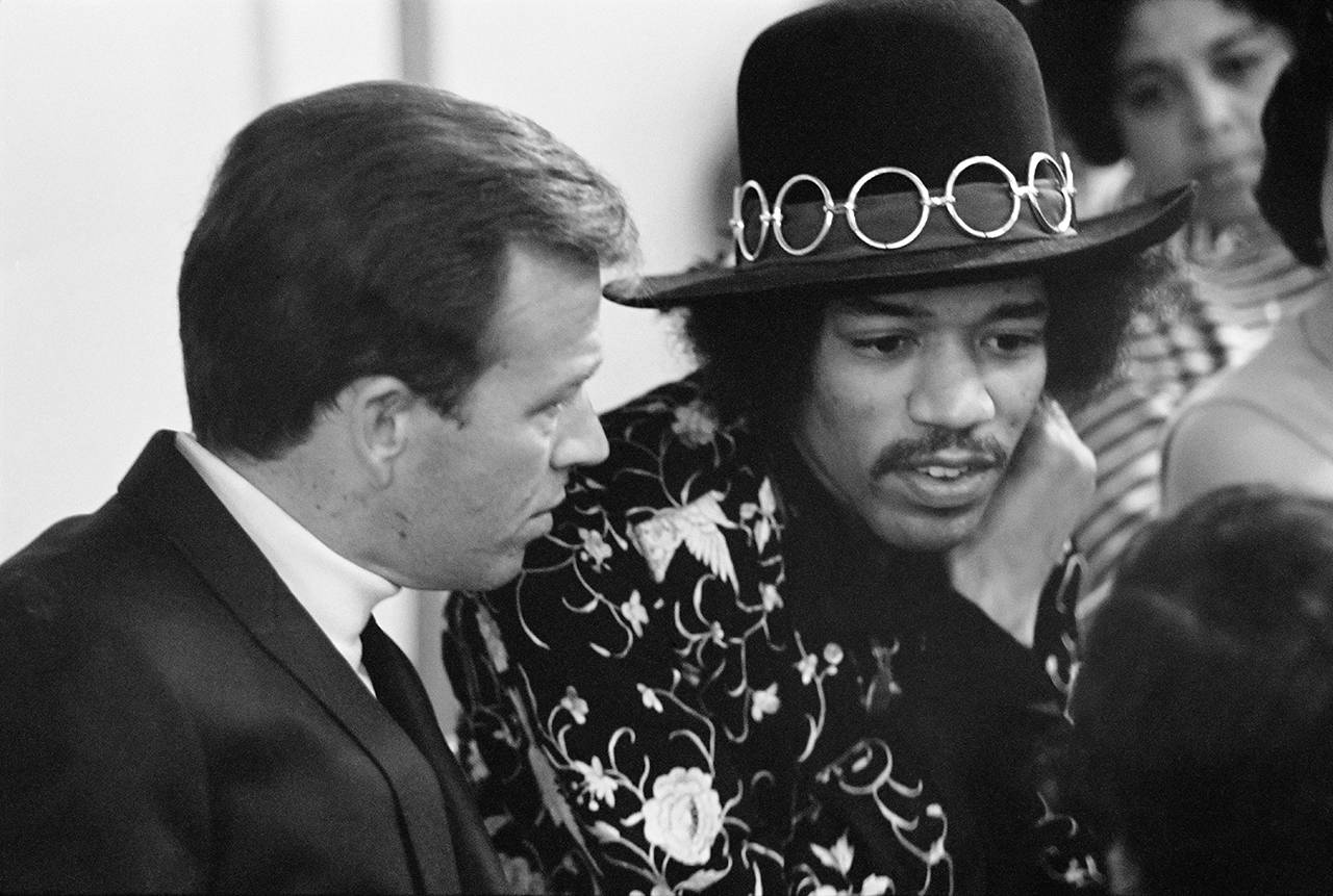 (Courtesy Peter Riches | Museum of Pop Culture) Pat O’Day talks with Jimi Hendrix at Seattle Center Arena in 1968.