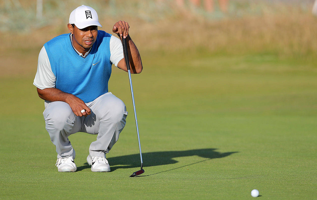 Tiger Woods lines up a putt on the 15th during day one of The Open Championship 2018 on Thursday, July 19, 2018 at Carnoustie Golf Links, Angus, Scotland. Woods shot a 71 on Friday and in contention at even par entering the weekend. (Richard Sellers/PA Wire/Zuma Press/TNS)