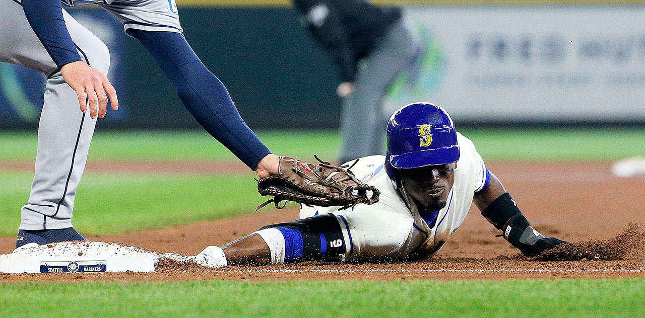 Seattle Mariners second baseman Dee Gordon hustles safely back to first base in the fourth inning during a Tampa Bay Rays pickoff play on Sunday, June 3, 2018, at Safeco Field in Seattle, Wash. Gordon expects to improve in the second half of the season. (Ken Lambert/Seattle Times/TNS)
