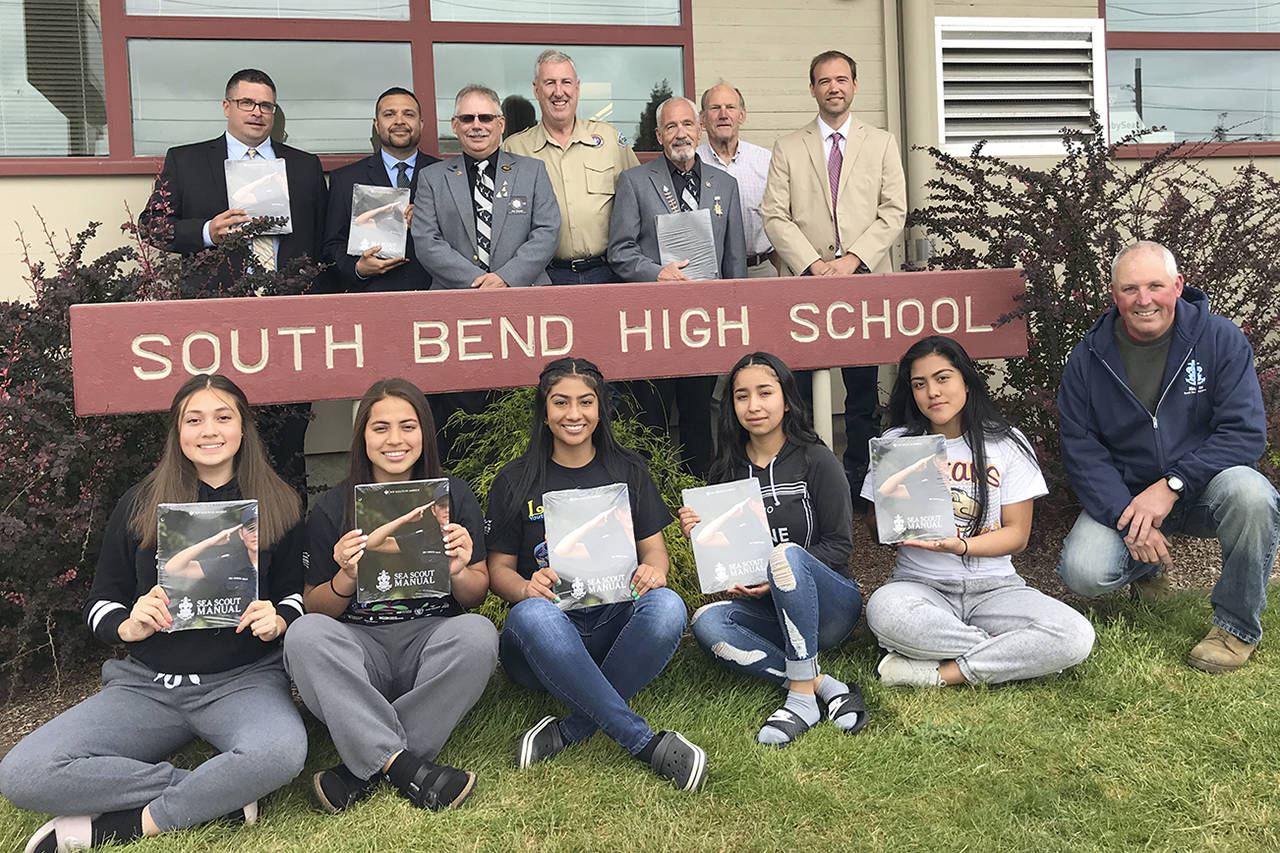 (Courtesy Tony Jennings) In the front row holding their new manuals, from left, are Willapa Harbor Sea Scouts Grecia Quintana, Alondra Rosas, Cynthia Orozco, Janeth Gutierrez and Yeni Silva, with unit leader Brian Sherman. In the back row, from left, are Jason Nelson, Sea Scout leader Manuel Rangel, Rod Bannish, Sea Scout leader Tim Quigg, Elks member Rick Smith, Sea Scout leader Gordon Chaffee and South Bend Superintendent Jon Tienhaara.