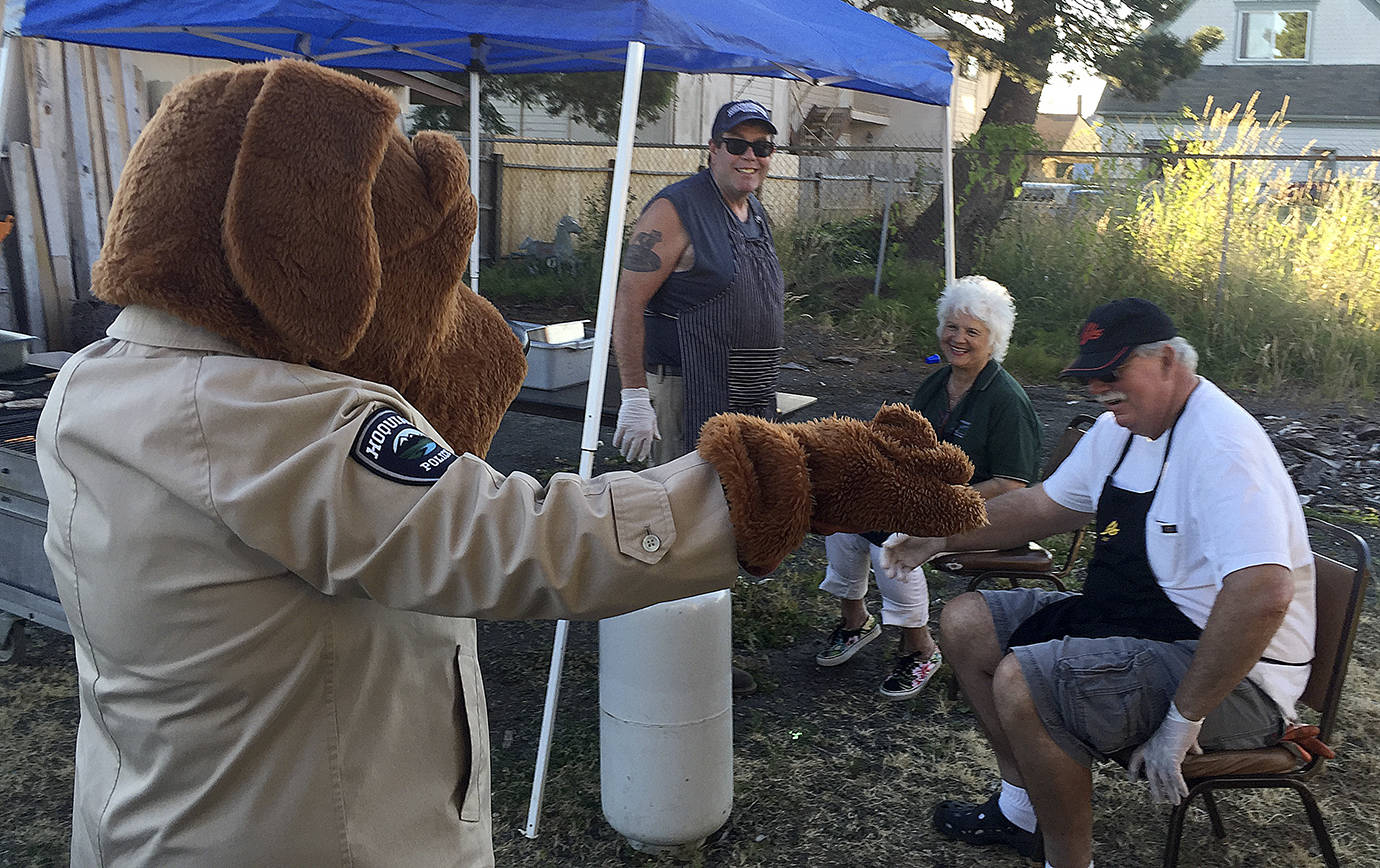 COURTESY HOQUIAM POLICE DEPARTMENT                                National Night Out, a program that brings community members together with local police and fire agencies, is coming to several locations across the Twin Harbors on Tuesday. Participating again this year will be the Hoquiam Police Department, which last year had McGruff the Crime Dog greeting area residents.