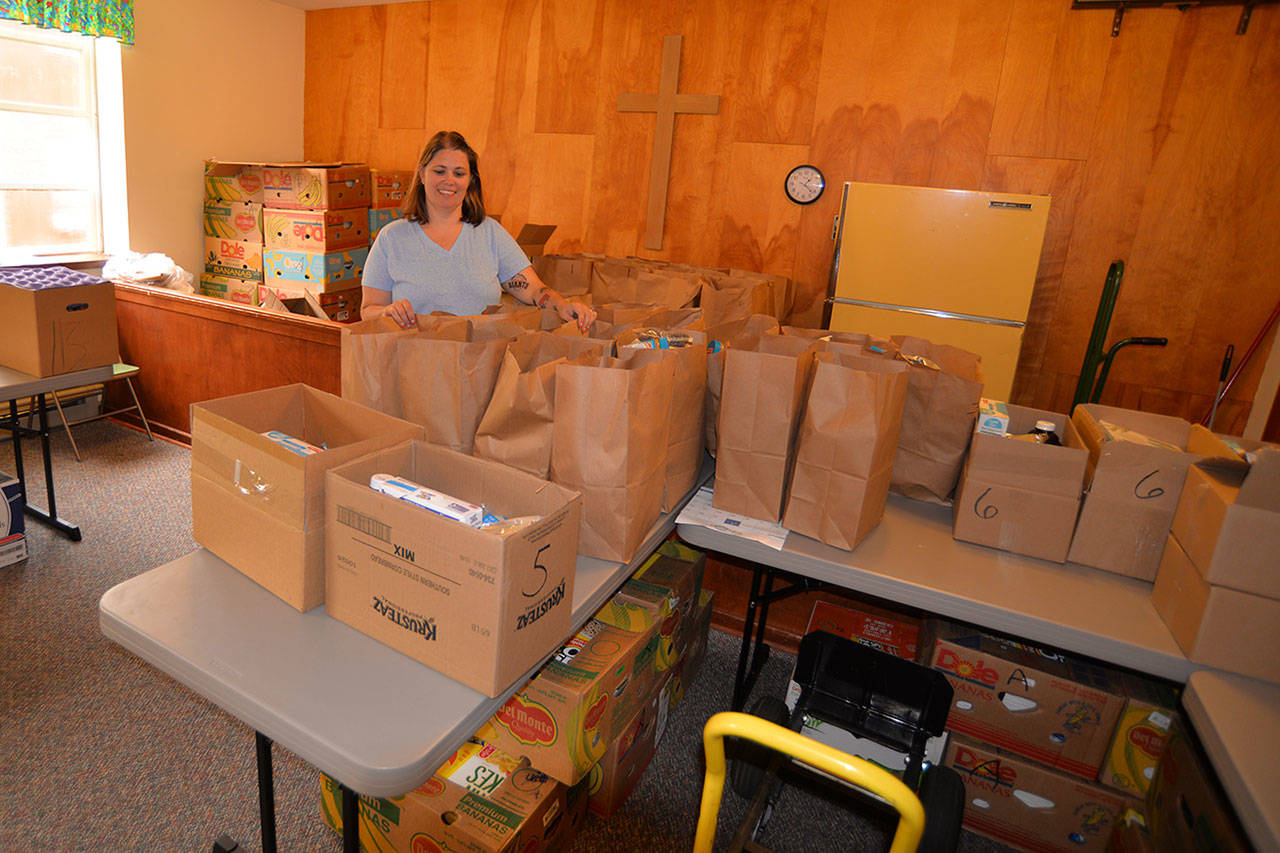 Louis Krauss | The Daily World                                Cher Keller, interim director of the Aberdeen Food Bank, stands in the services new temporary location in First Presbyterian Church of Aberdeen.
