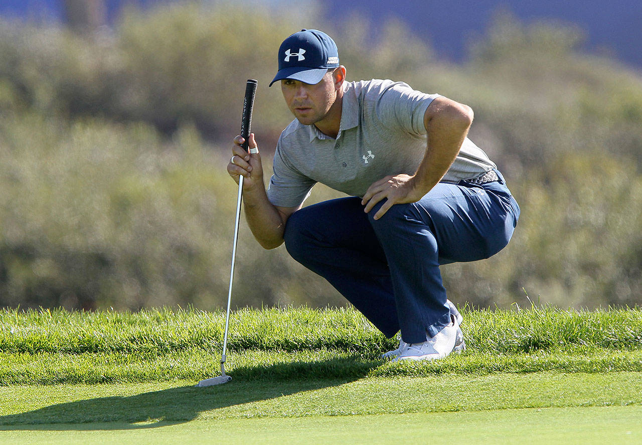 Gary Woodland, seen here in a file photo, made par on the final hole to take a 1-stroke lead at the PGA Championship on Friday. (Charlie Neuman/San Diego Union-Tribune/TNS)