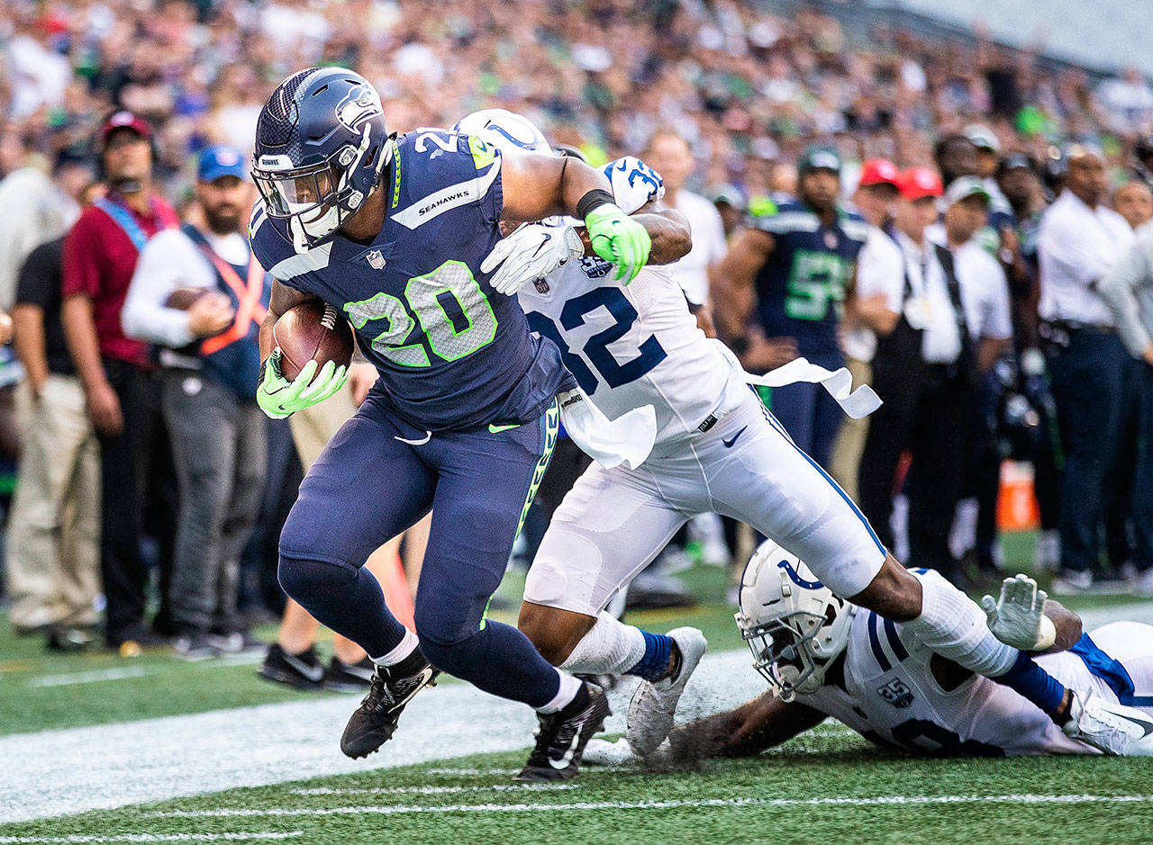 Seattle Seahawks running back Rashaad Penny (20) sets up Seattle’s first score with a 6-yard run to the 4-yard line in the first quarter against the Indianapolis Colts in preseason action at CenturyLink Field in Seattle on Thursday, Aug. 9, 2018. Penny reportedly underwent surgery to repair a broken pointer finger on Wednesday in Philadelphia. (Dean Rutz/Seattle Times/TNS)