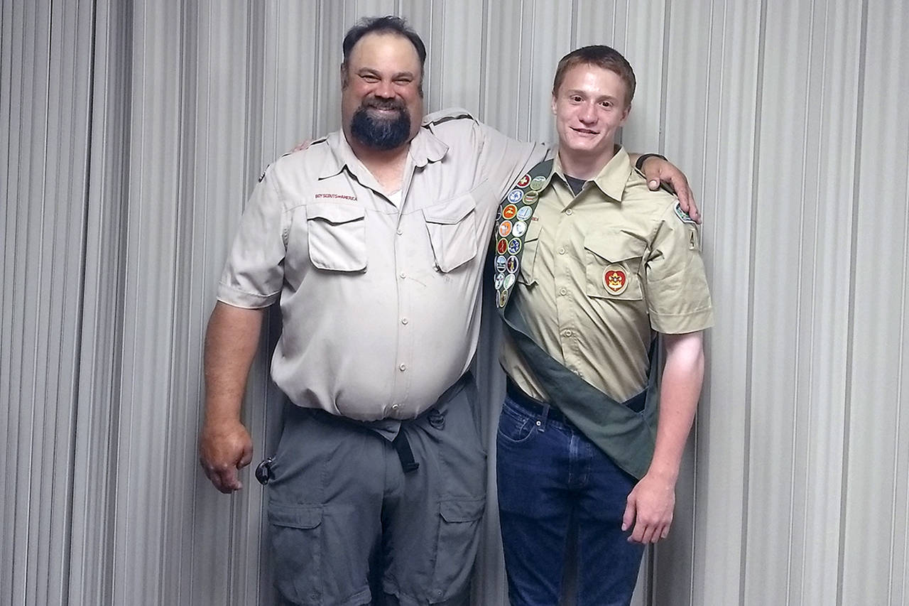 (Courtesy Worlton family) Troop 4040 Scoutmaster Rex Anglovich poses with new Eagle Scout Aidan Worlton.