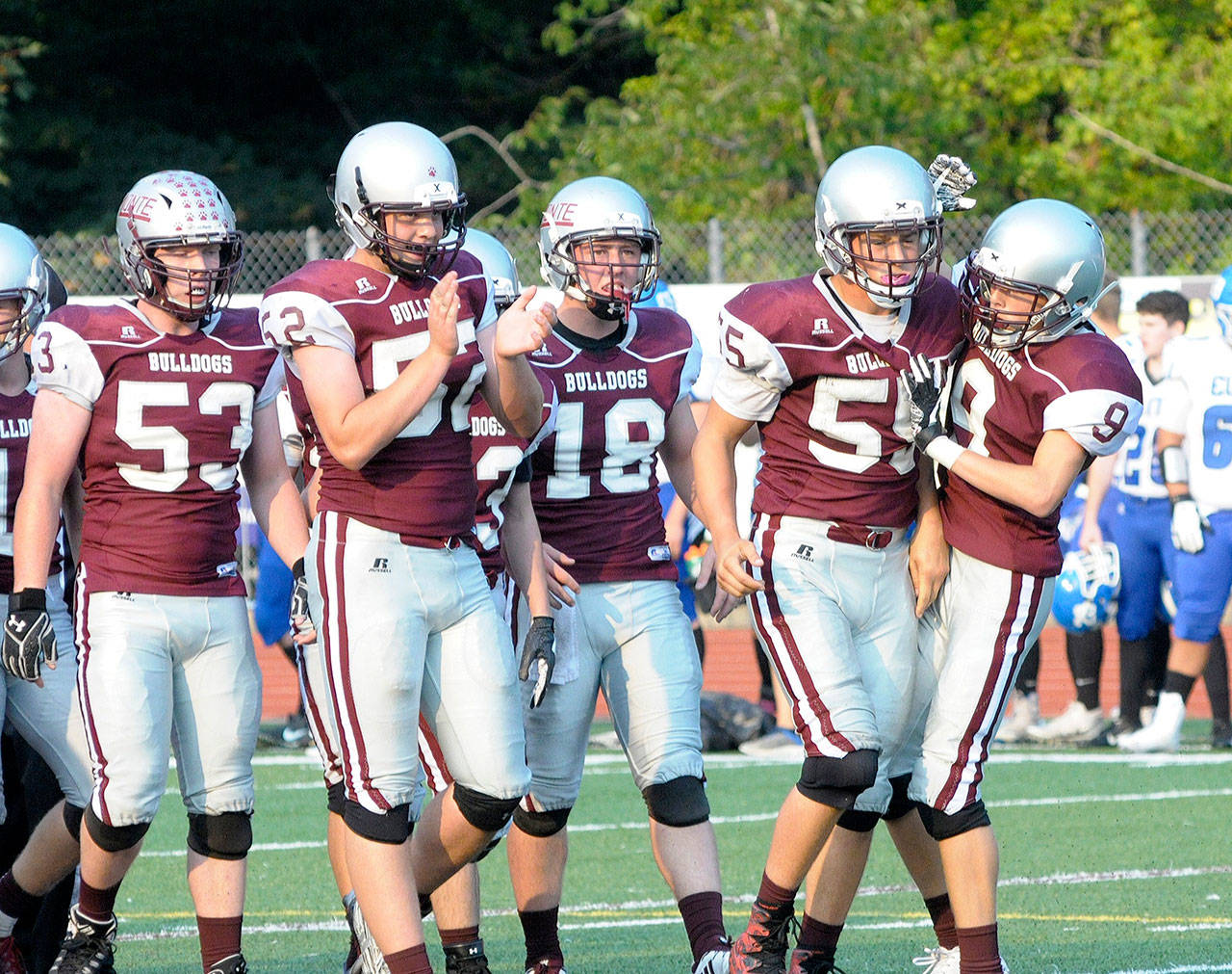 Montesano teammates congratulate Kai Olson (55) after making a tackle in the backfield at the Jamboree on Friday. (Hasani Grayson | The Daily World)