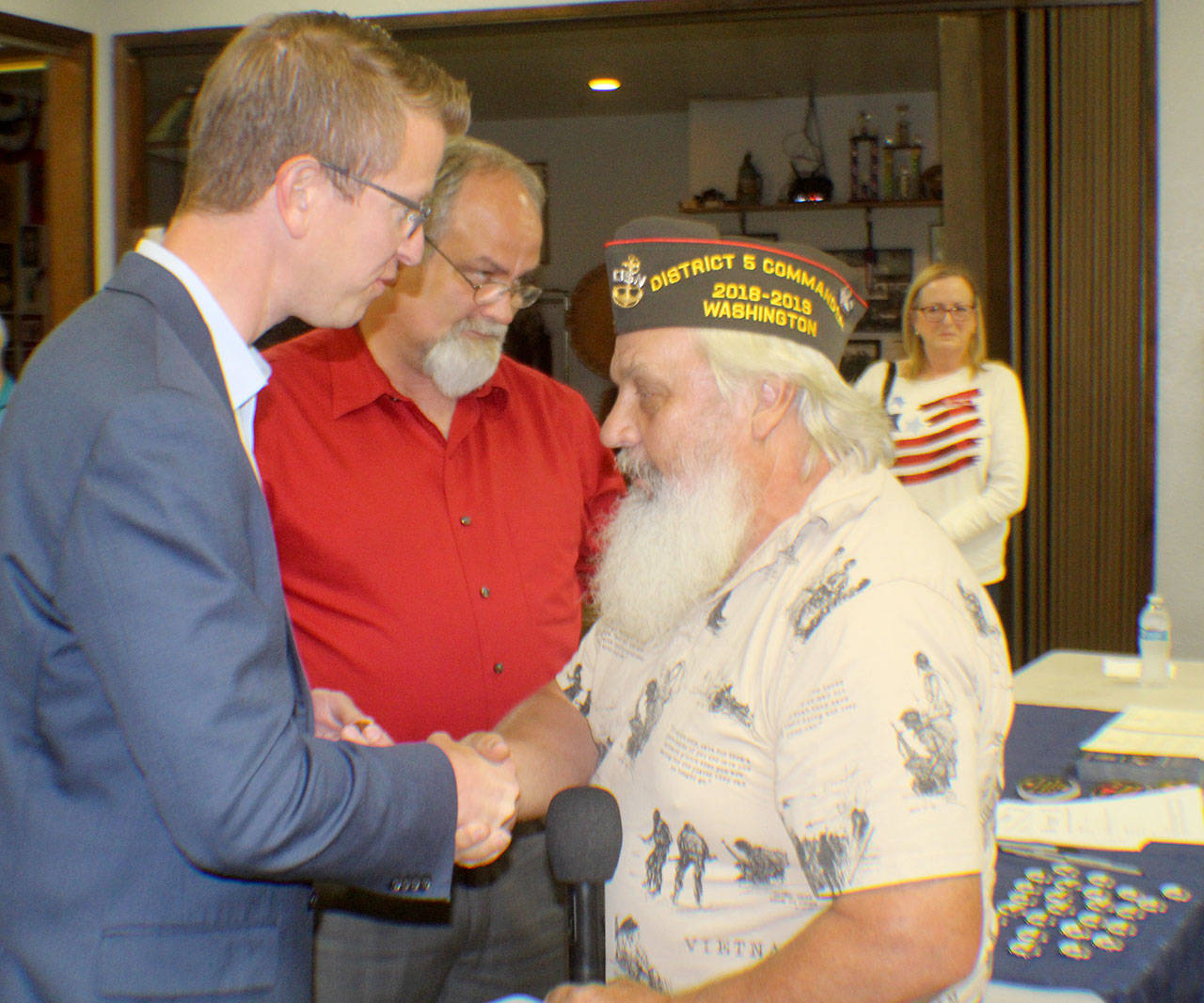 Bill Wickwire, right, shakes hands with Rep. Derek Kilmer during a ceremony to honor Vietnam vets Wednesday, Aug. 22, 2018, in Elma. Wickwire is the Veterans of Foreign Wars District 5 commander. He is with the Elma Post 1948. Photo by Michael Lang, The Vidette