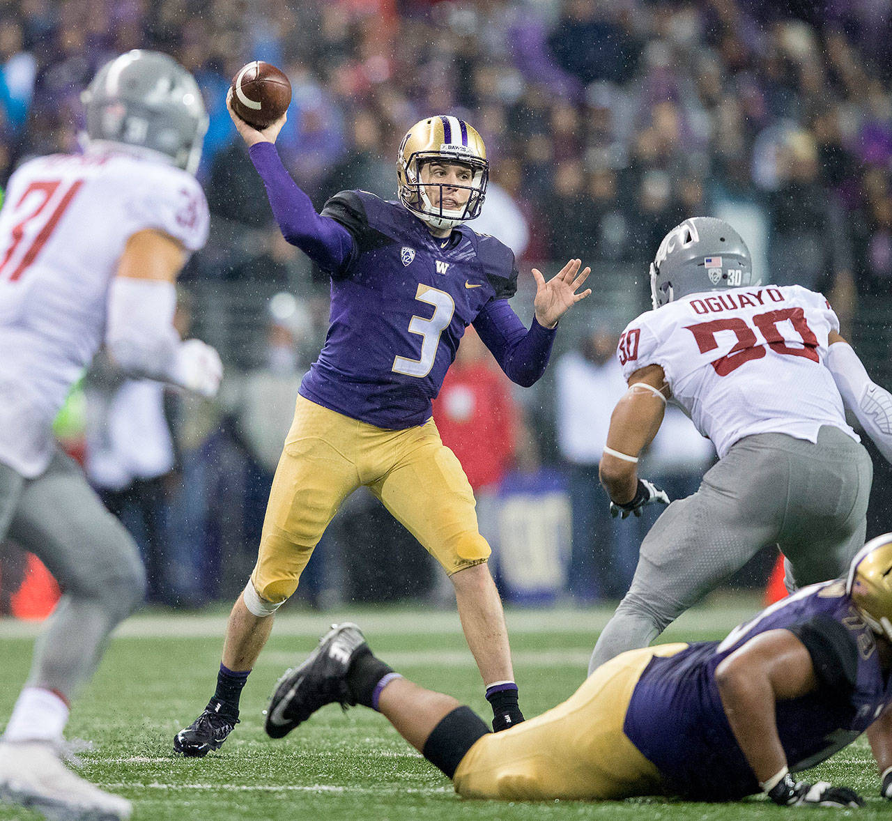 Washington quarterback Jake Browning (3) makes a second-quarter throw against Washington State November 25, 2017. The No. 6 Huskies open the season against No. 9 Auburn in a highly-anticipated contest at 12:30 p.m. Saturday. (Mike Siegel/Seattle Times/TNS)