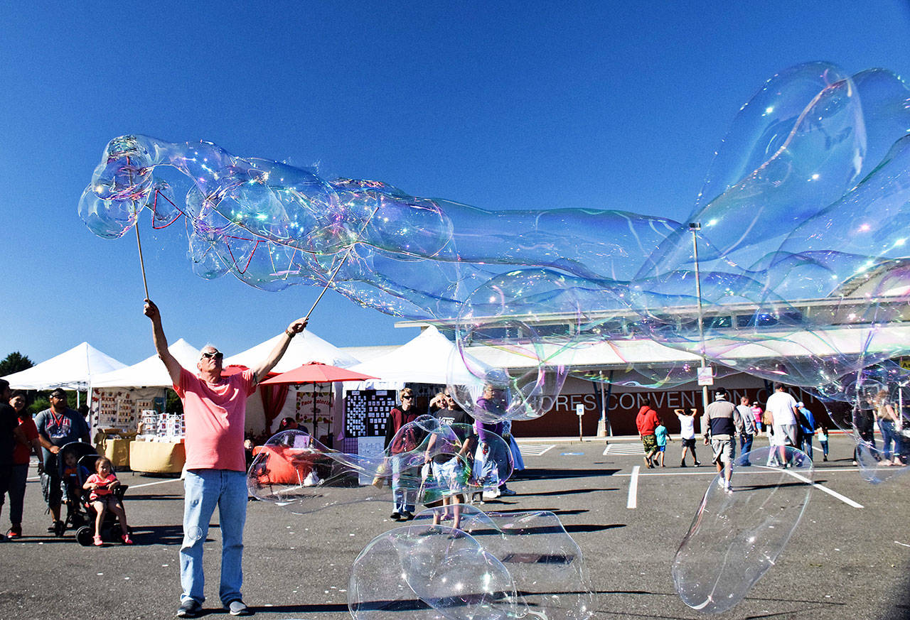 At the Ocean Shores Convention Center, “Bubble Artist” Ed Schroll, who doubles as the president of Associated Arts of Ocean Shores, delighted young and old alike during the 50th annual AAOS Arts & Crafts Festival Saturday afternoon. Scott D. Johnston photo