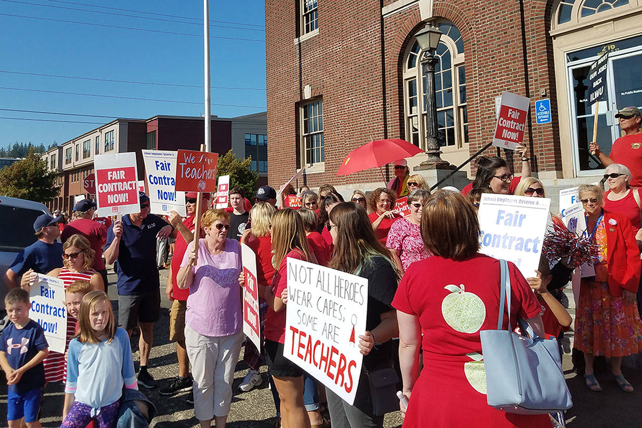 (Courtesy Michelle Reed) Teachers and community members crowd the sidewalk next to the Aberdeen School District offices on Wednesday prior to a bargaining session. The teachers union reached a tentative agreement on a new contract with the school district at 1:40 a.m. on Thursday.