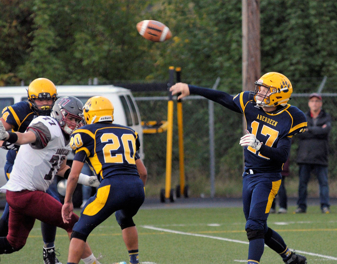 Aberdeen’s Ben Dublanko throws a pass downfield against Hoquiam on Friday. (Hasani Grayson | The Daily World)