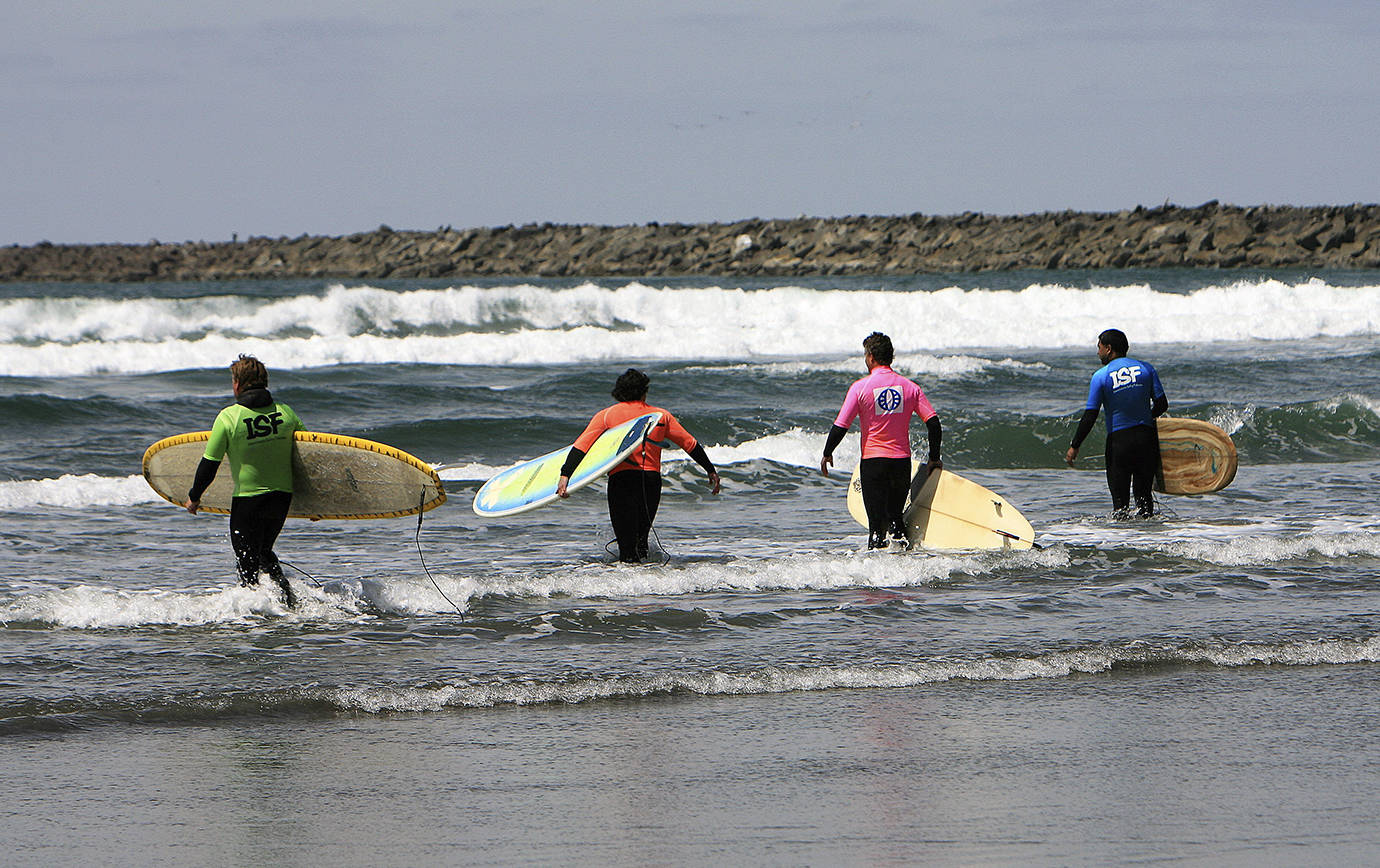 PHOTO COURTESY OF WESTPORTMIKE                                Four competitors walk into the surf during last year’s event.