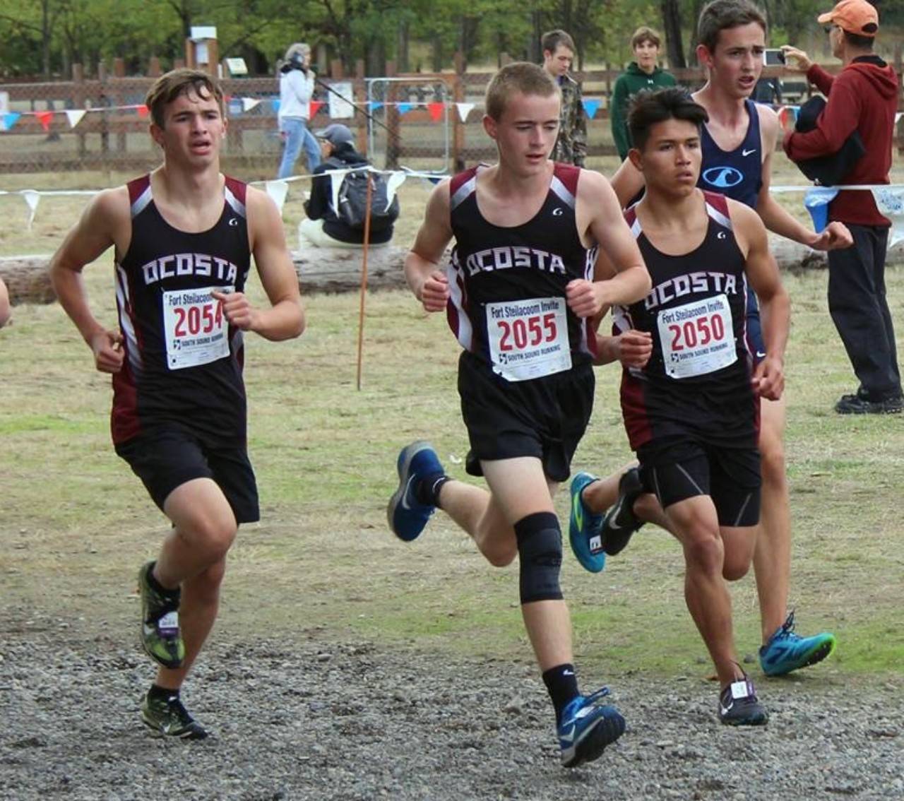 Ocosta boys cross country runners (from left) Daniel Quinby, Dylan Todd, Alex Bailey race at the Fort Steliacoom Invitational on Saturday in Lakewood. (Photo by Aaron Anderson)