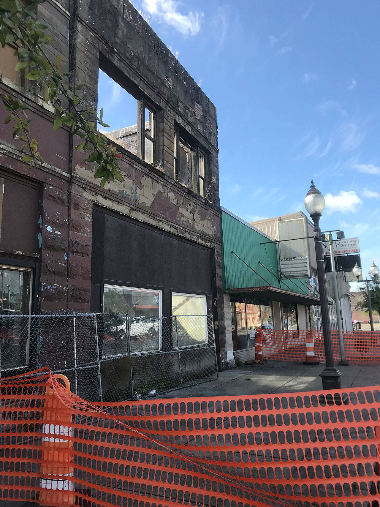 Louis Krauss | The Daily World                                This building along East Heron Street was identified as unstable, and recently had the sidewalk blocked off as well as the parking spaces next to it.