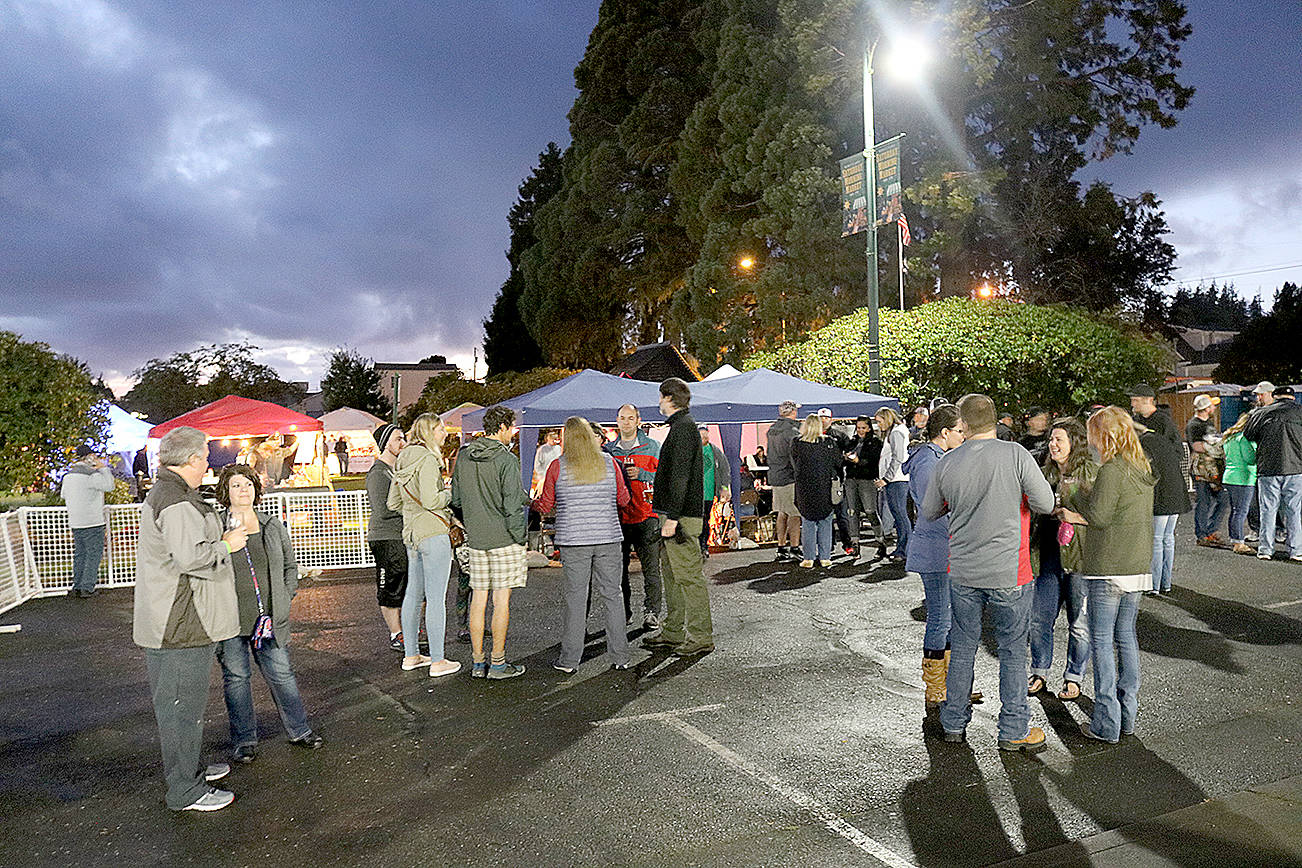 Photos by Travis Rains | The Vidette file                                Music is easily heard from outside of Whitney’s detail shop where the 2017 Catch Montesano Fish and Brew Fest attendees ate, played cornhole and took a break from the crowded shop.