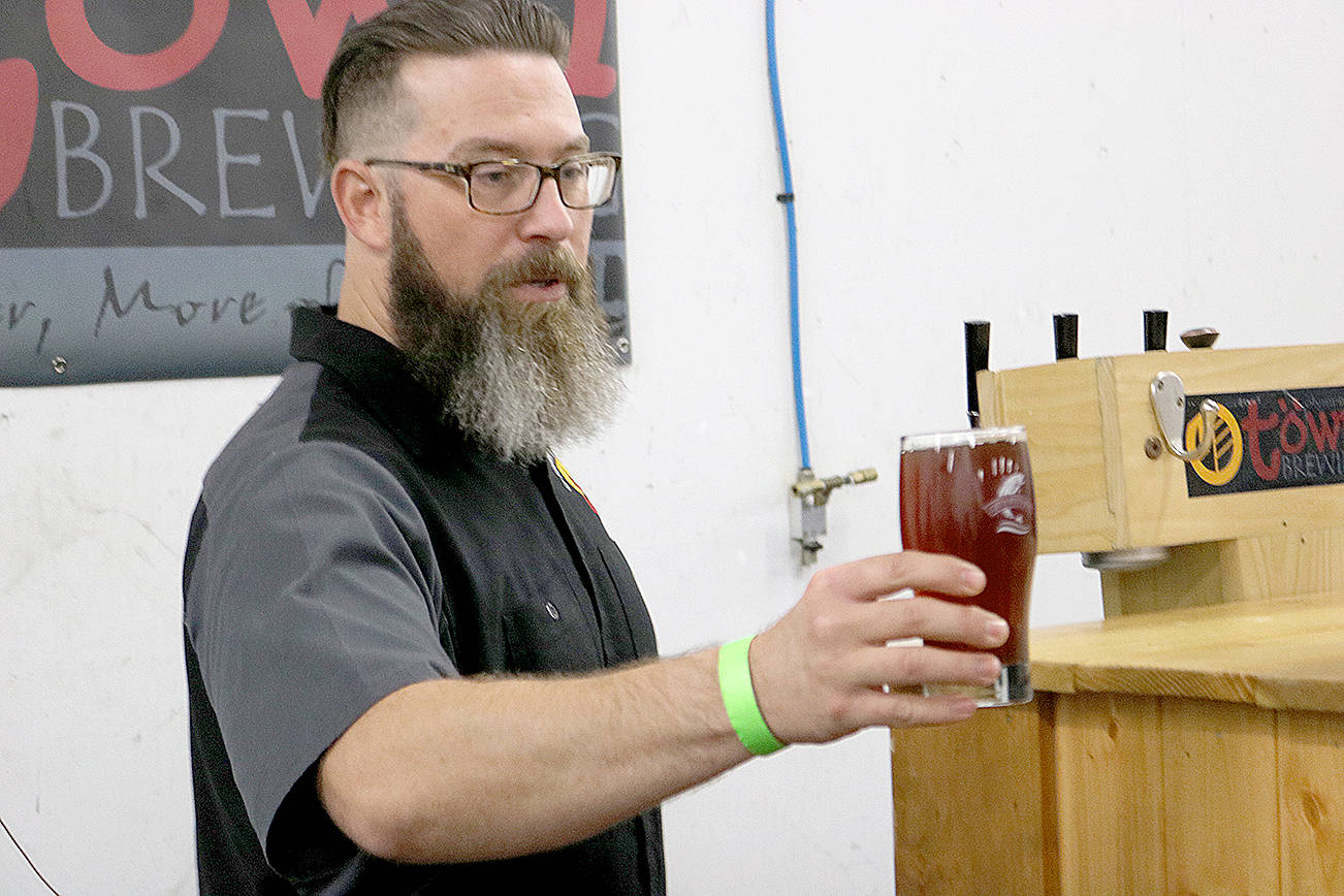 O-Town Brewing of Olympia was on-hand at 2017’s Catch Montesano Fish and Brew Fest downtown. Brewer Jason Stenzel offered a freshly poured beer to an attendee inside Whitney’s detail shop.