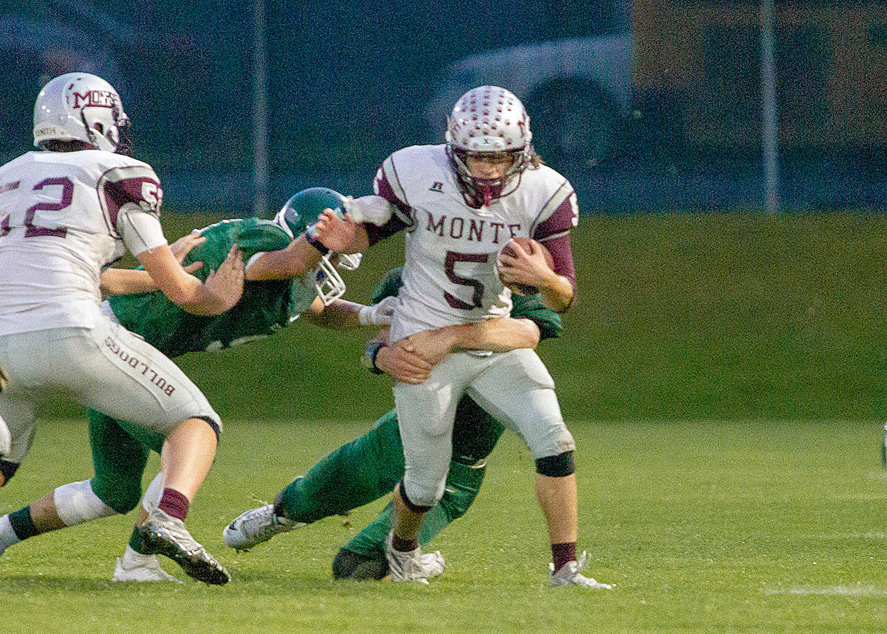 Montesano’s Teegan Zillyett carries the ball against Port Angeles on Friday. Zillyett finished the game with 14 carries and 140 yards. (Photo by Shawn Donnelly)