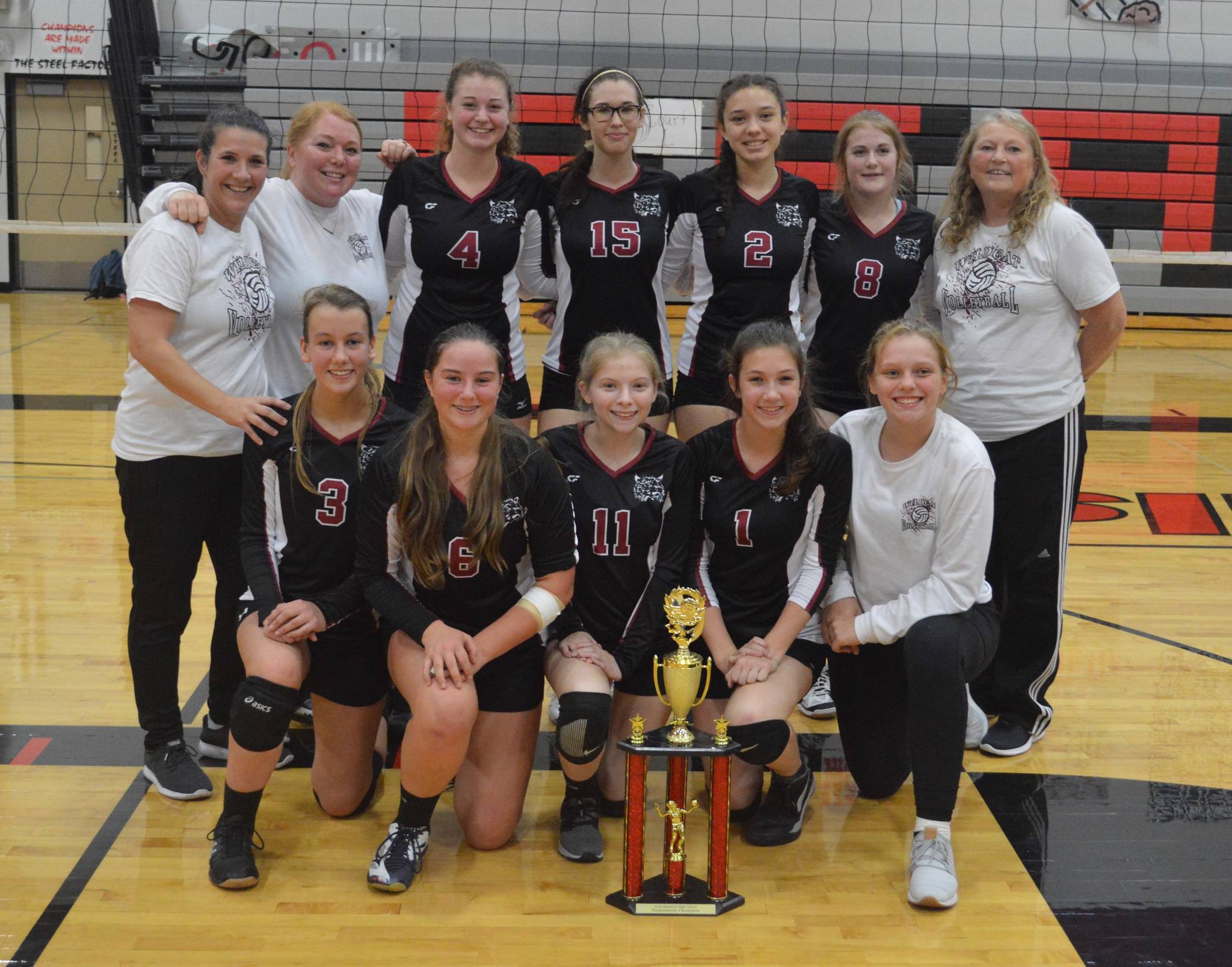 The Ocosta Wildcats volleyball team poses with its first-place trophy after winning the Raymond Tournament on Saturday at Raymond High School. (Photo by Jim Snider)