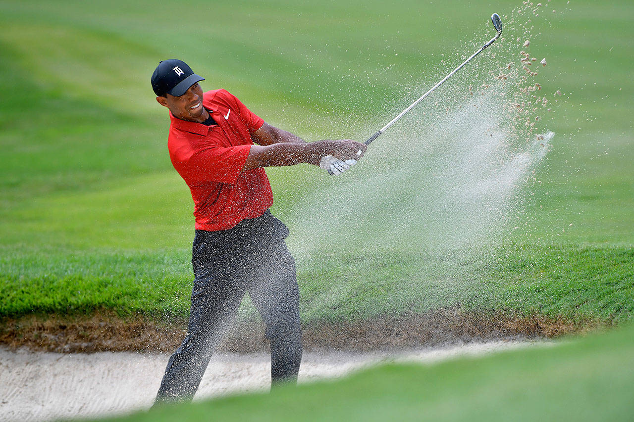 Tiger Woods plays a shot from a bunker on the fifth hole during the final round of the Tour Championship on Sunday, Sept. 23, 2018 at East Lake Golf Club in Atlanta, Ga. (Hyosub Shin/Atlanta Journal-Constitution/TNS)