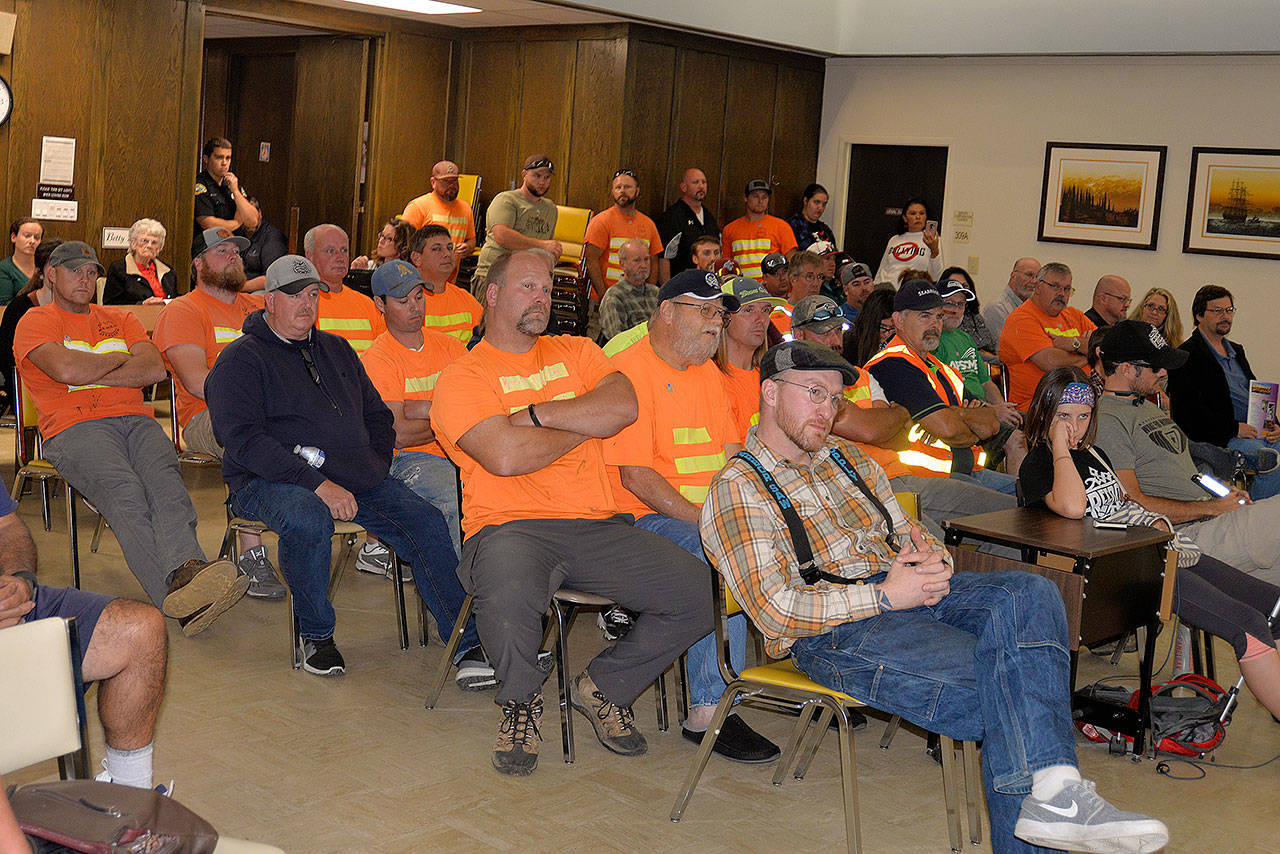 Louis Krauss | The Daily World                                Aberdeen city workers listen as council members discuss potential pay raises for department heads and a few select city staff positions.
