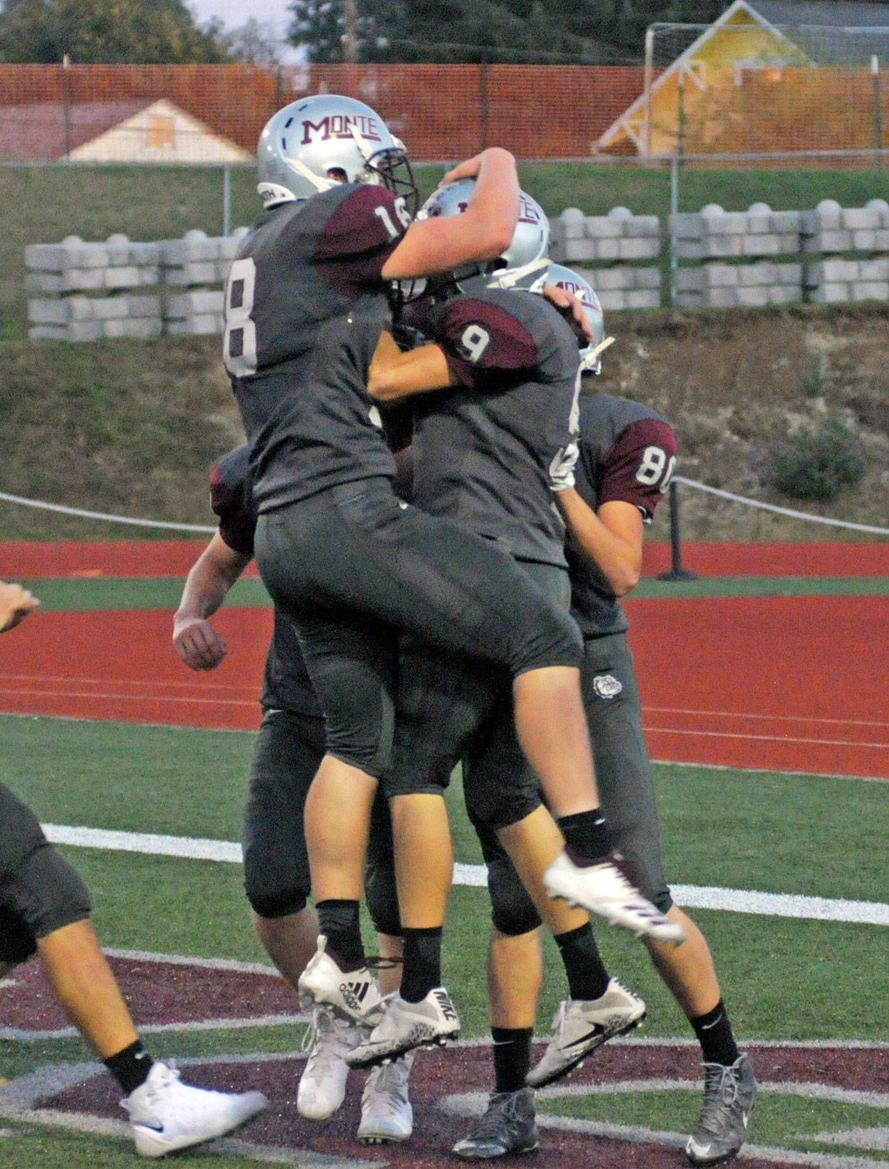 Montesano’s Braden Dohrman (9) celebrates with Shaydon Farmer (18) after Dohrman caught a 50-yard touchdown pass in the first quarter against Forks on Friday. (Hasani Grayson | The Daily World)