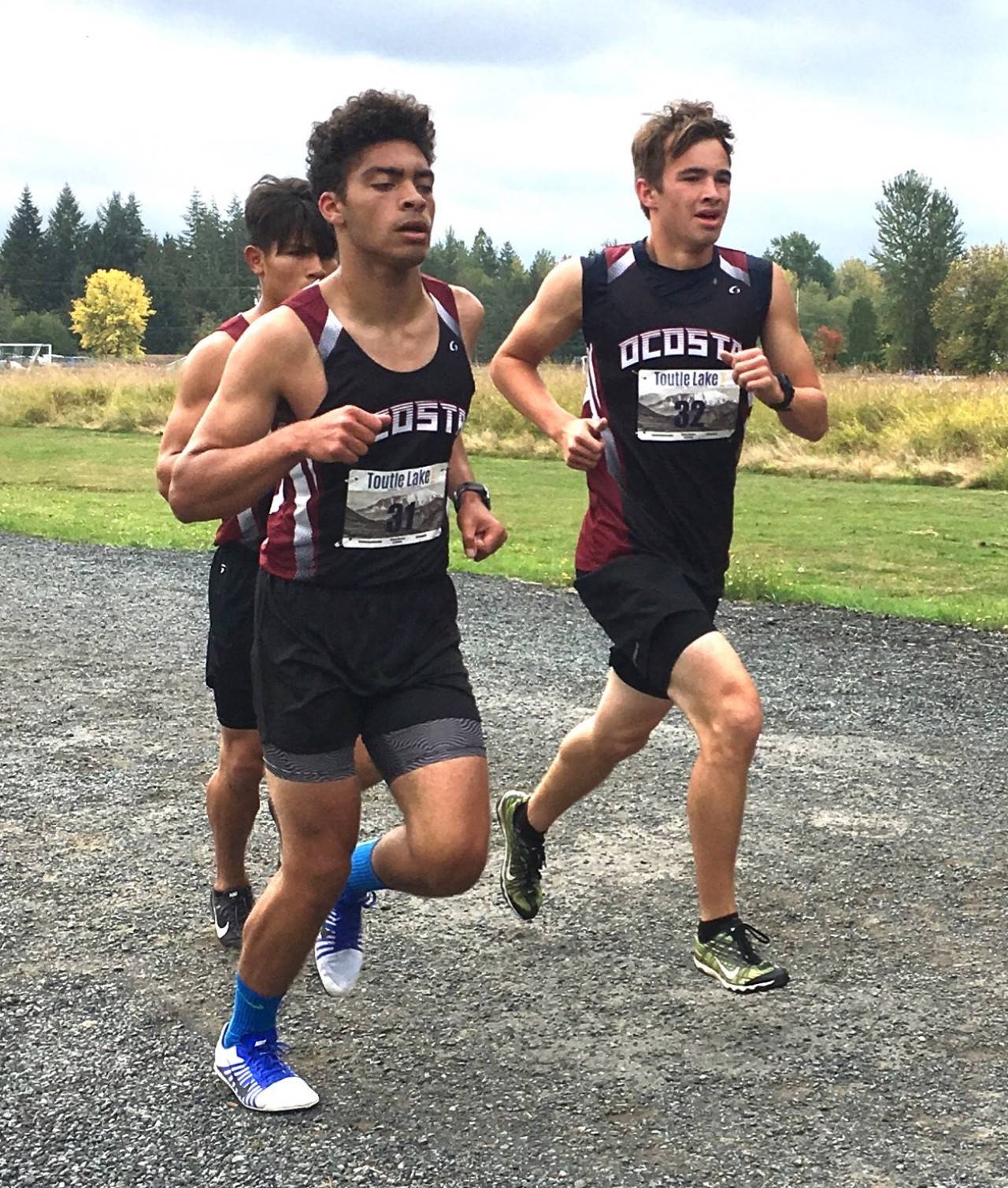 Ocosta’s Danny Lennon, foreground, Daniel Quinby, right, and Alex Bailey group up during the Toutle Lake Invitational cross country meet on Saturday. (Photo courtesy of Aaron Anderson)
