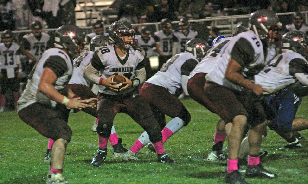 Hoquiam quarterback Payton Quintanilla, middle, leads his undefeated Grizzlies team into a critical matchup against Montesano on Friday, with the potential league title on the line. (Hasani Grayson | Grays Harbor News Group)