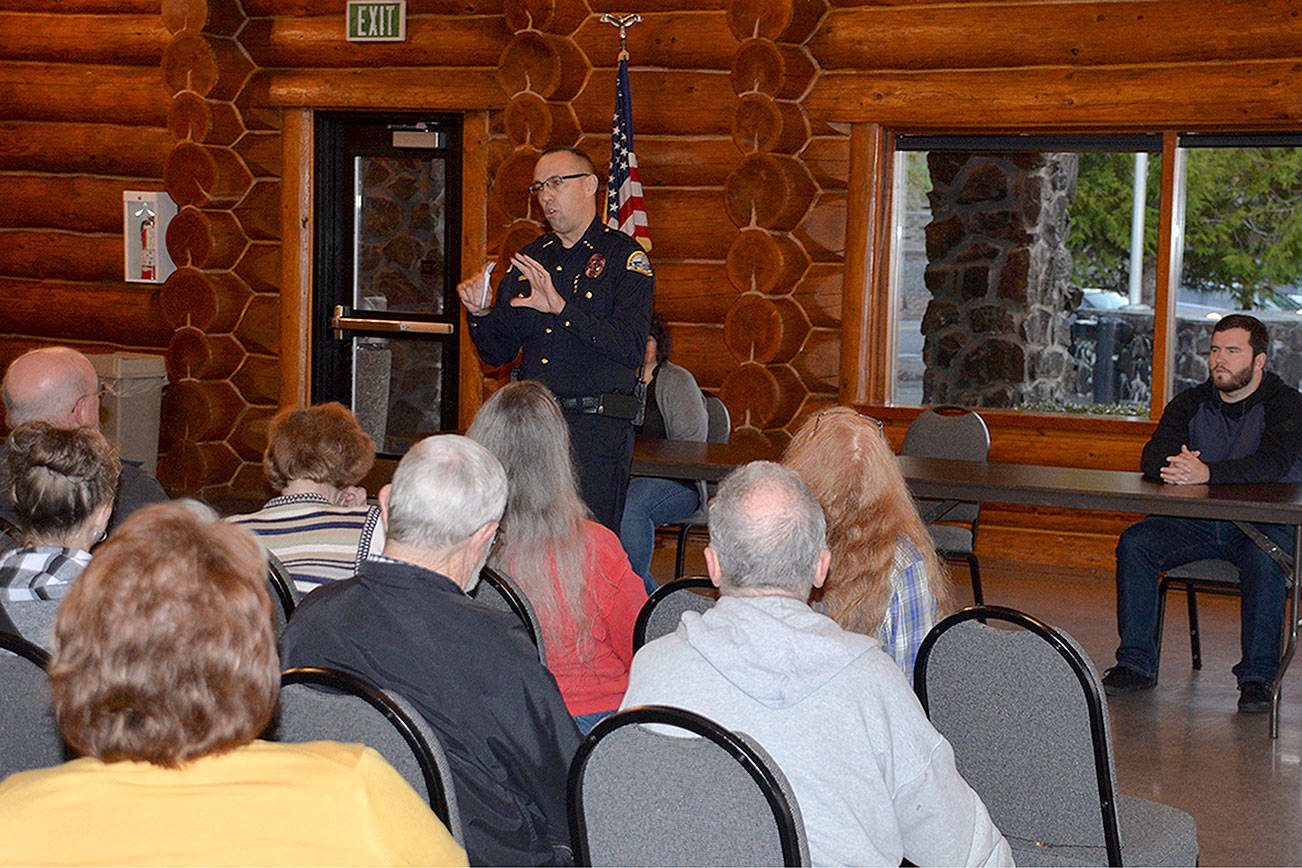 Louis Krauss | The Daily World                                Aberdeen Police Chief Steve Shumate speaks to the crowd during a community meeting Thursday night at the Rotary Log Pavilion.