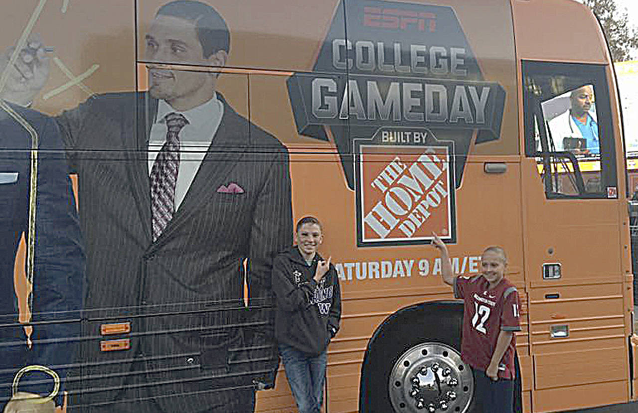 Kirsten Frichette, formerly of Elma, submitted this photo of her kids, Carter, 14, and Keira, 10, posing with ESPN’s College GameDay bus in Pullman before heading to school the morning before the game.