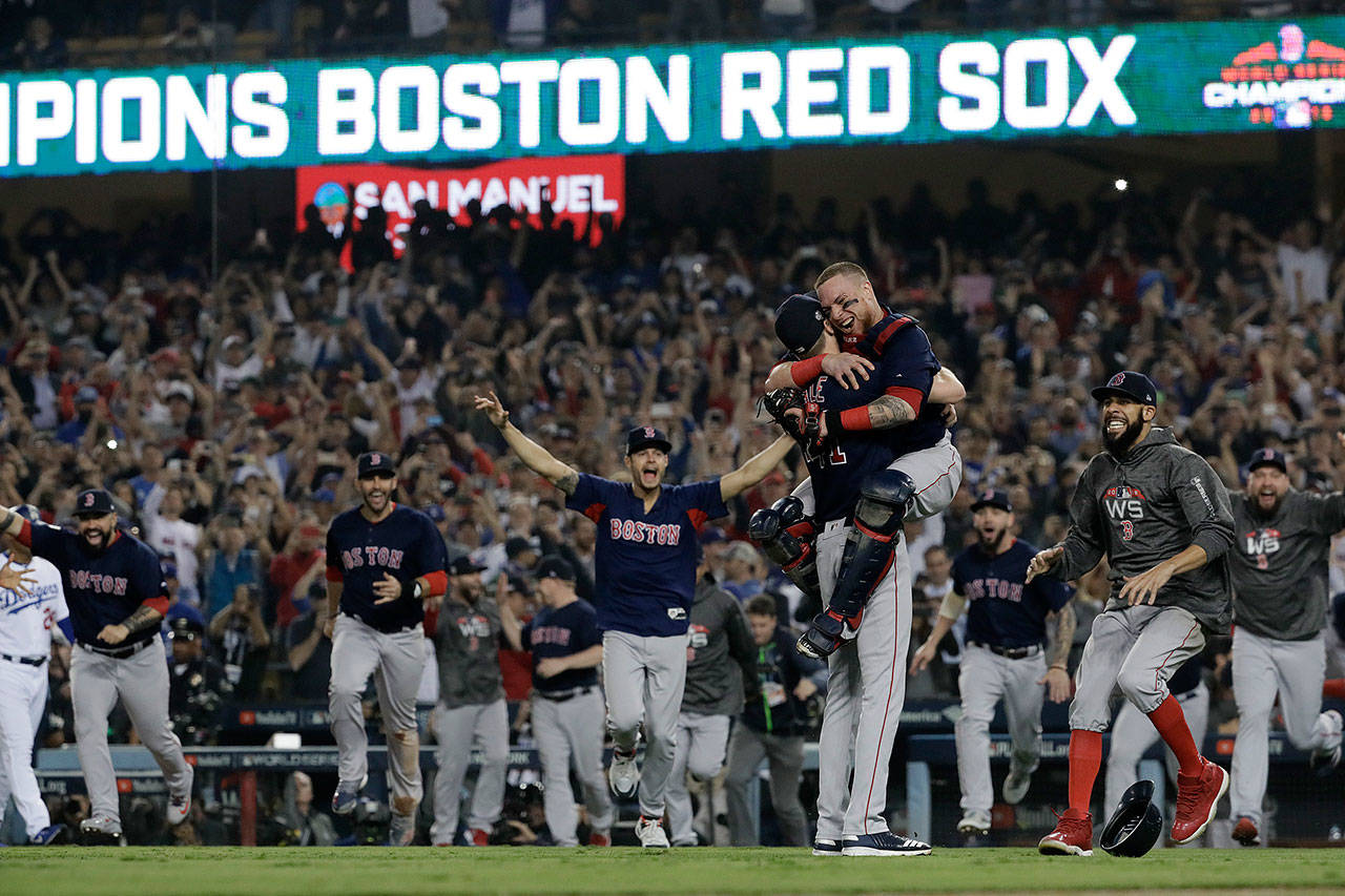 Boston Red Sox Christian Vazquez and Chris Sale celebrate winning the World Series against the Los Angeles Dodgers in Game 5 of the World Series on Sunday, Oct. 28, 2018 at Dodger Stadium in Los Angeles, Calif. (Robert Gauthier/Los Angeles Times/TNS)