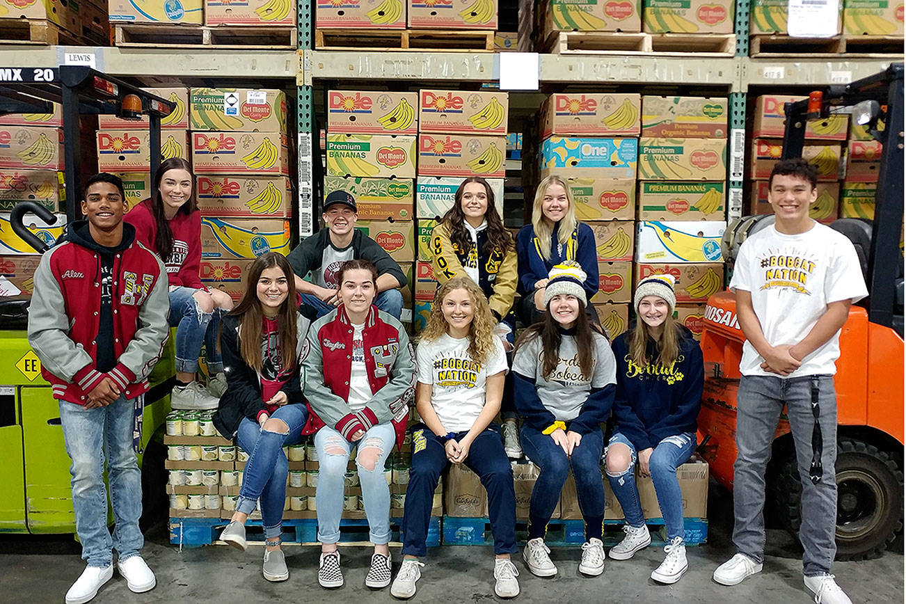 Photo by Kyle Pauley                                 Student leaders from both schools are preparing for Food Ball 2018. Hoquiam students, from left, are Alex Houbregs, Elyse Goulet, Lucy Roloff, Jackson Folkers and Taylor Strom. Aberdeen students in the back row are Camryn Cook and Abbie Bradt. In the front row are Molly Scroggs, Brooke Solan, Lauren King and Patch Hunt.