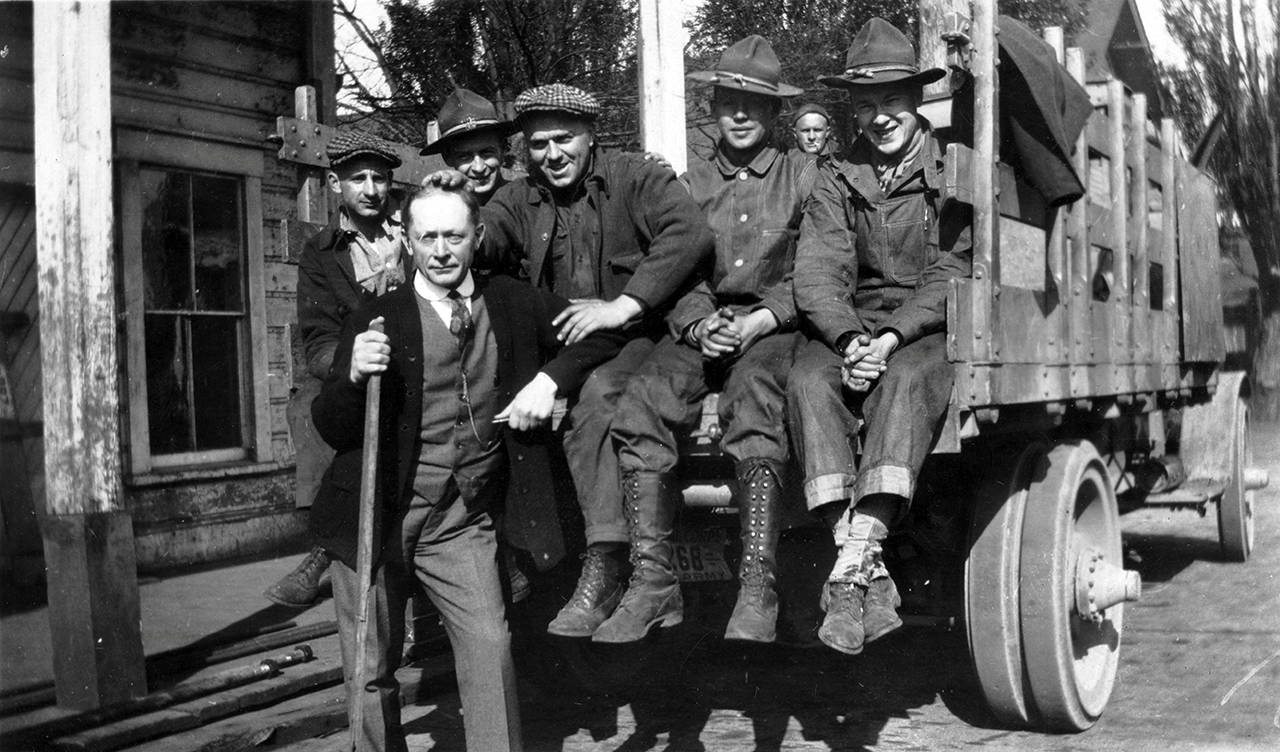 (Courtesy of Polson Museum) Spruce Division soldiers sitting on a stake-bed truck.