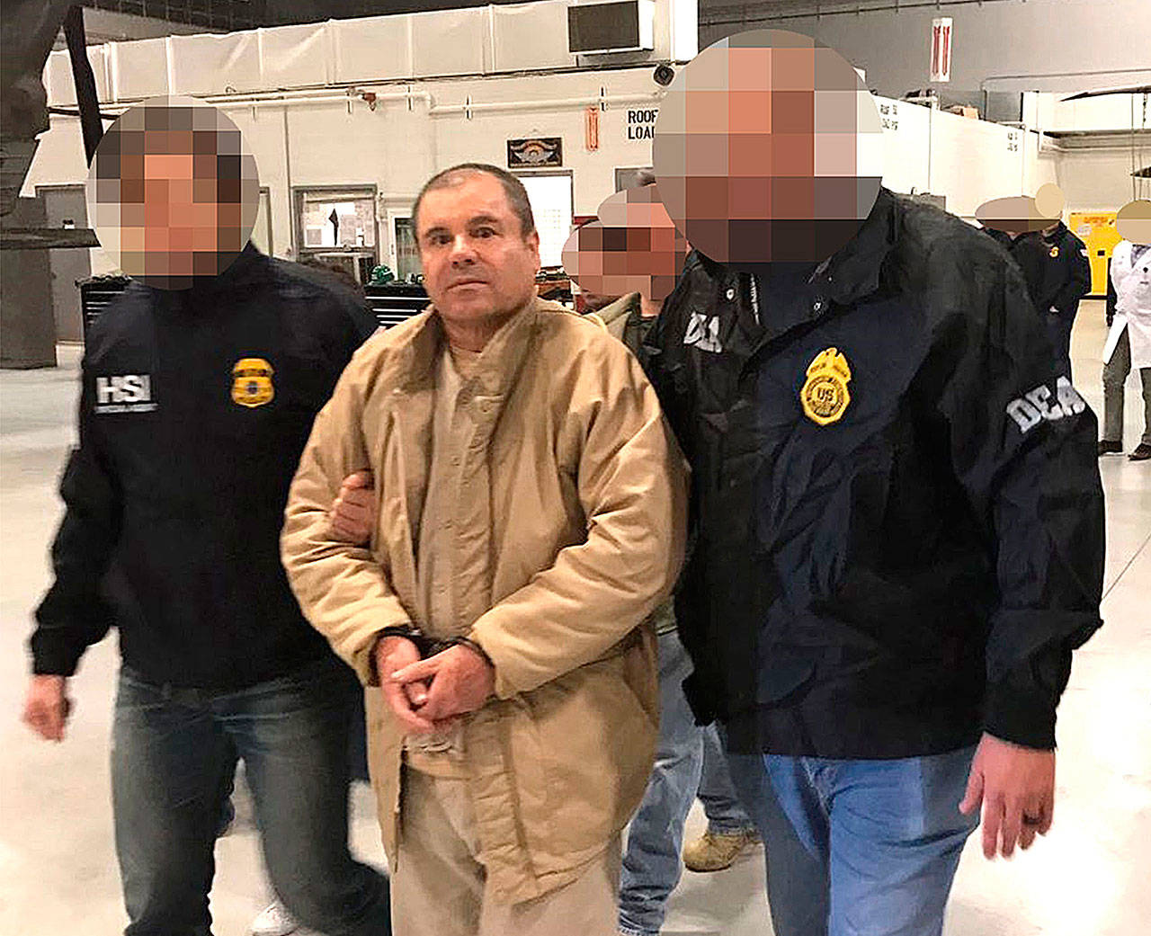 Image provided by the Attorney General of the Republic (PGR) of Mexico shows drug lord Joaquin Guzman Loera, alias “El Chapo,” was extradited to the United States on January 19, 2017, and flown from a jail in Ciudad Juarez, Mexico, to Long Island MacArthur Airport in Islip, N.Y., to face charges. (Prensa Internacional)