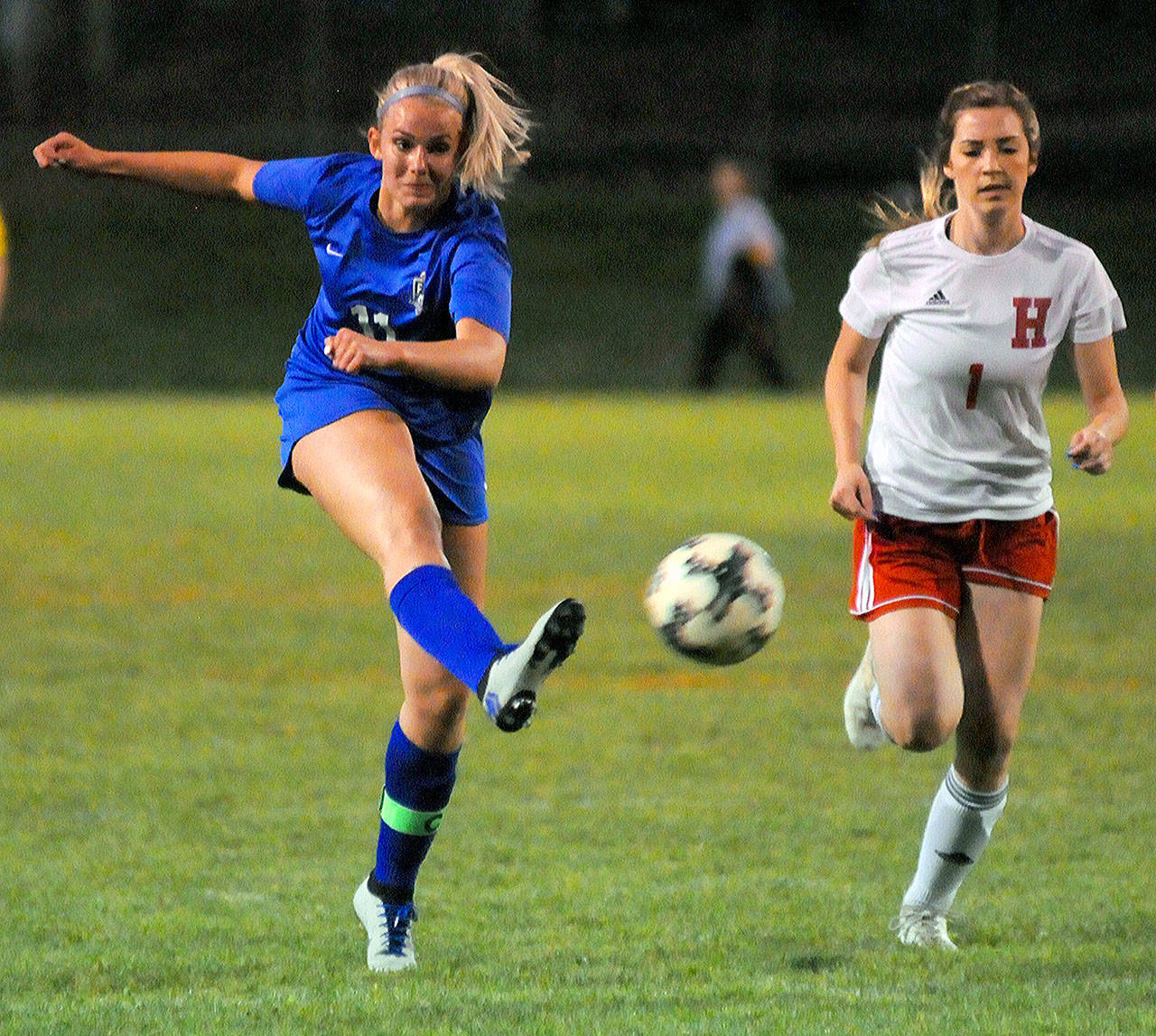 Elma’s Brooke Sutherby, left, takes a shot on goal during a home game against Hoquiam on Sept. 27. Sutherby was named the 1A Evergreen league’s co-MVP for offense earlier this week. (Hasani Grayson | Grays Harbor News Group)