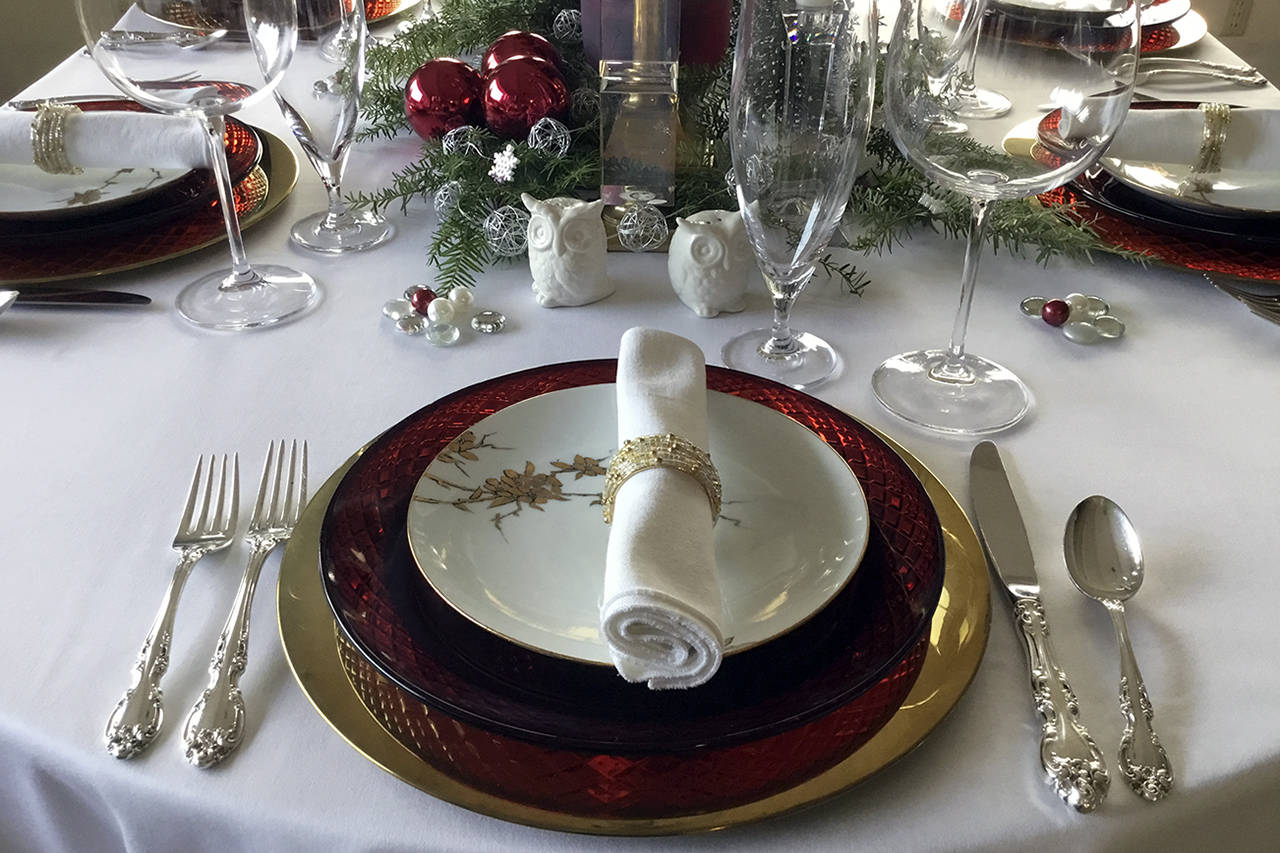 (Mitchell Chapman) The ruby red glass dinner plates are the perfect color for Christmas, and the salad plates with gold hand-painted flowers cost less than $1 each.