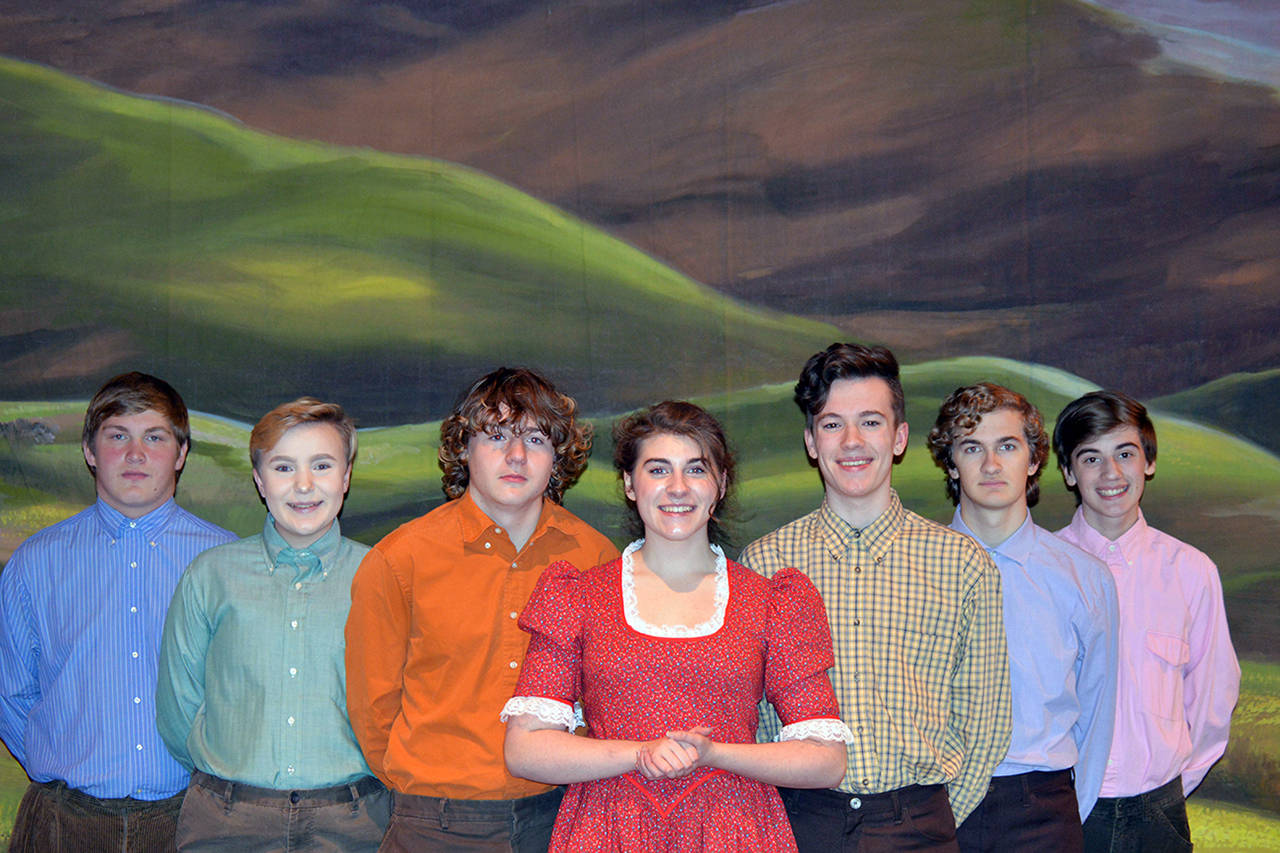 Photos by Paulian Beardsley                                The Pontipee brothers flank Milly (Kendall Cavin) after she teaches them about etiquette and courting a girl. From left, Adam’s six brothers are played by Trevor Mullin, Andy Blake, Dakota Cruikshank, Justin Haven, Parris Nicholson and Evan Weidman.