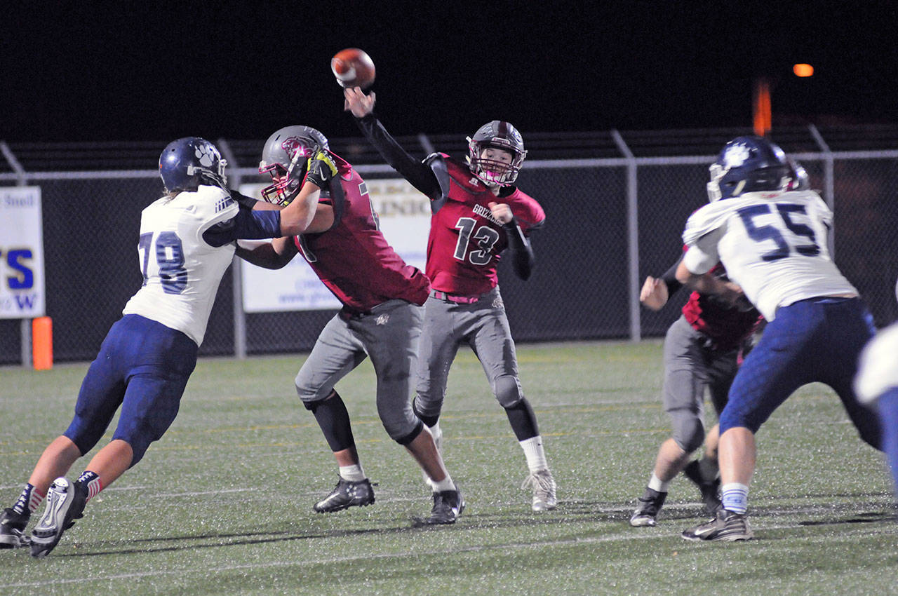Hoquiam back-up quarterback Jackson Folkers throws downfield during the second half of the Grizzlies’ 45-6 loss to Lynden Christian in a 1A state quarterfinal playoff game on Saturday at Stewart Field in Aberdeen. (Ryan Sparks | Grays Harbor News Group)