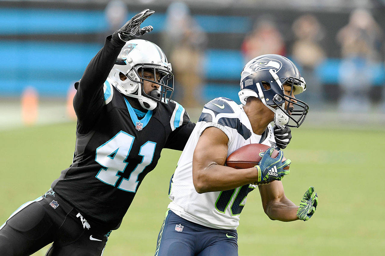 Seattle Seahawks wide receiver Tyler Lockett’s (16) 43-yard reception against Carolina Panthers defensive back Captain Munnerlyn (41) put them at the Panthers’ 10-yard line late in the game on Sunday, Nov. 25, 2018 at Bank of America Stadium in Charlotte, N.C. (David T. Foster III/Charlotte Observer/TNS)