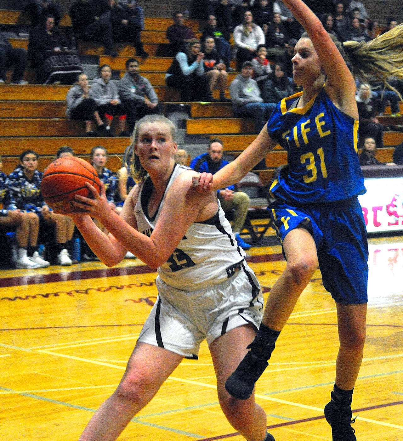 Montesano’s Zoe Hutchings pump fakes before scoring under the basket in a game against Fife on Wednesday. Hutchings led teh Bulldogs with 18 points. (Hasani Grayson | Grays Harbor News Group)