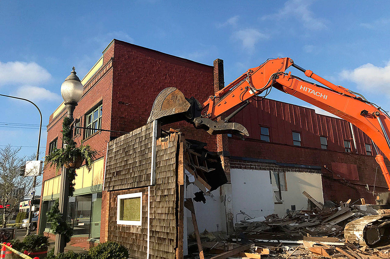 Louis Krauss | Grays Harbor News Group                                An excavator from Rognlins Inc. takes down the Pourhouse building in Aberdeen.