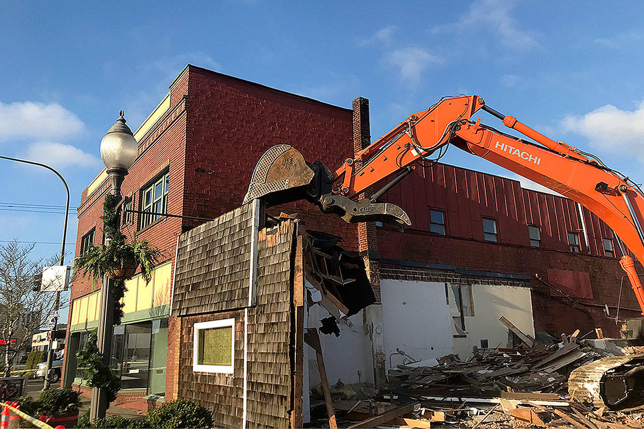 Louis Krauss | Grays Harbor News Group                                An excavator from Rognlins Inc. takes down the Pourhouse building in Aberdeen.