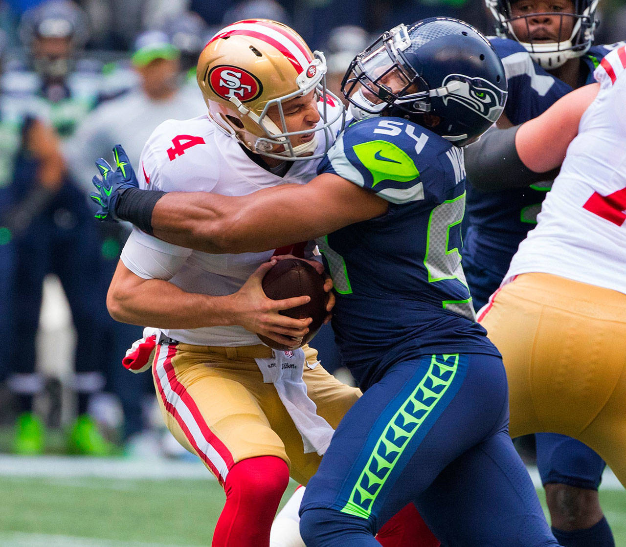 Seattle Seahawks middle linebacker Bobby Wagner (54) crushes and sacks San Francisco 49ers quarterback Nick Mullens (4) during first quarter action on Sunday, Dec. 2, 2018 at CenturyLink Field in Seattle, Wash. (Mike Siegel/Seattle Times/TNS)
