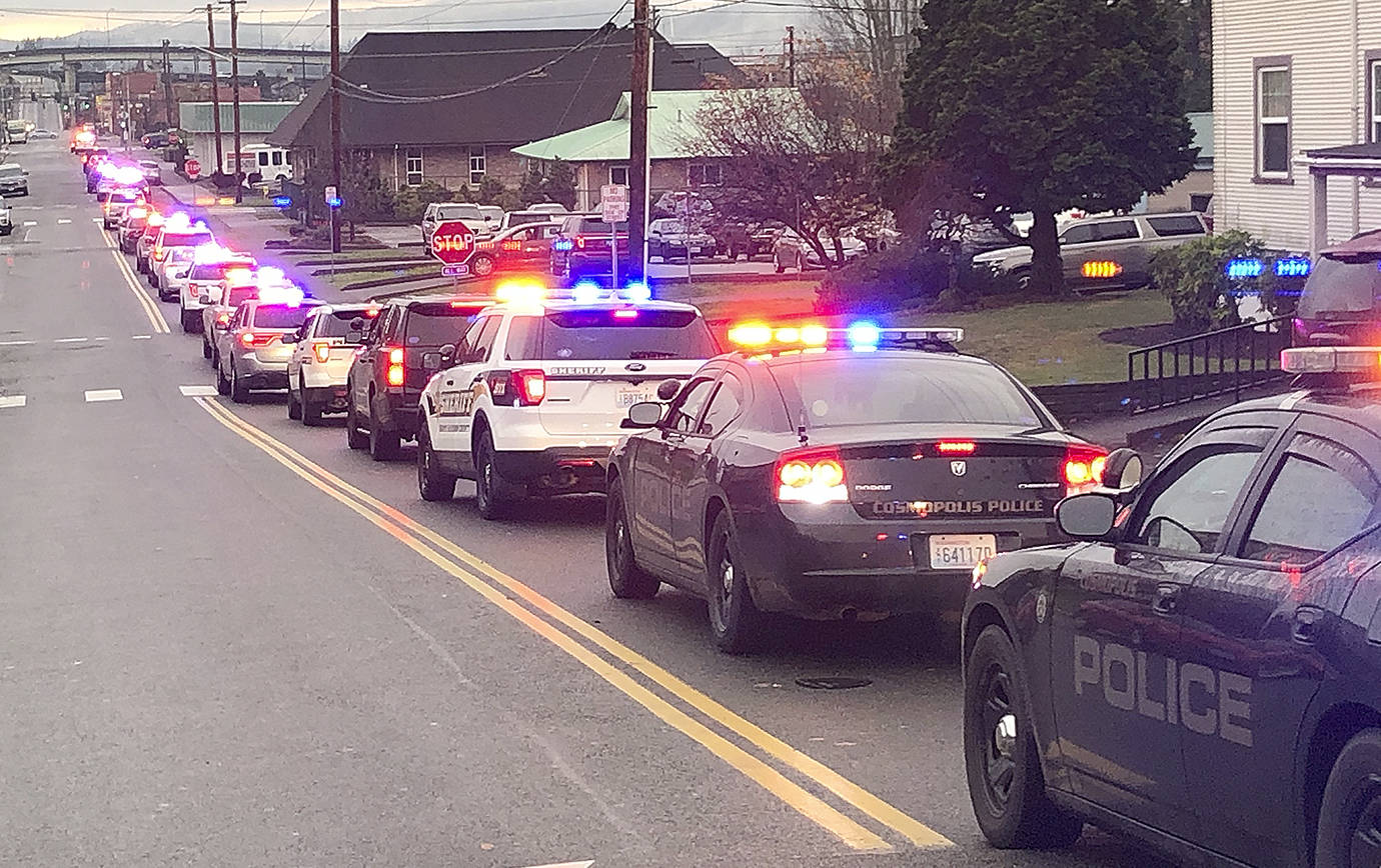Law enforcement vehicles from across Grays Harbor County filled with kids head to Walmart from breakfast at Aberdeen High School Saturday morning for the 2018 Shop with a Cop event.