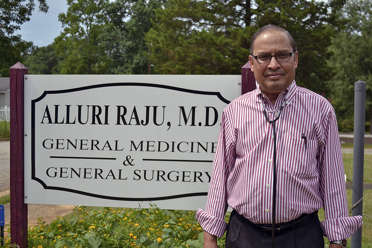 Dr. Alluri Raju, who has been practicing in the rural Georgia town of Richland for 37 years, said he initially faced discrimination, but that has dissipated. He is now the only doctor in town. (Katja Ridderbusch | KHN)