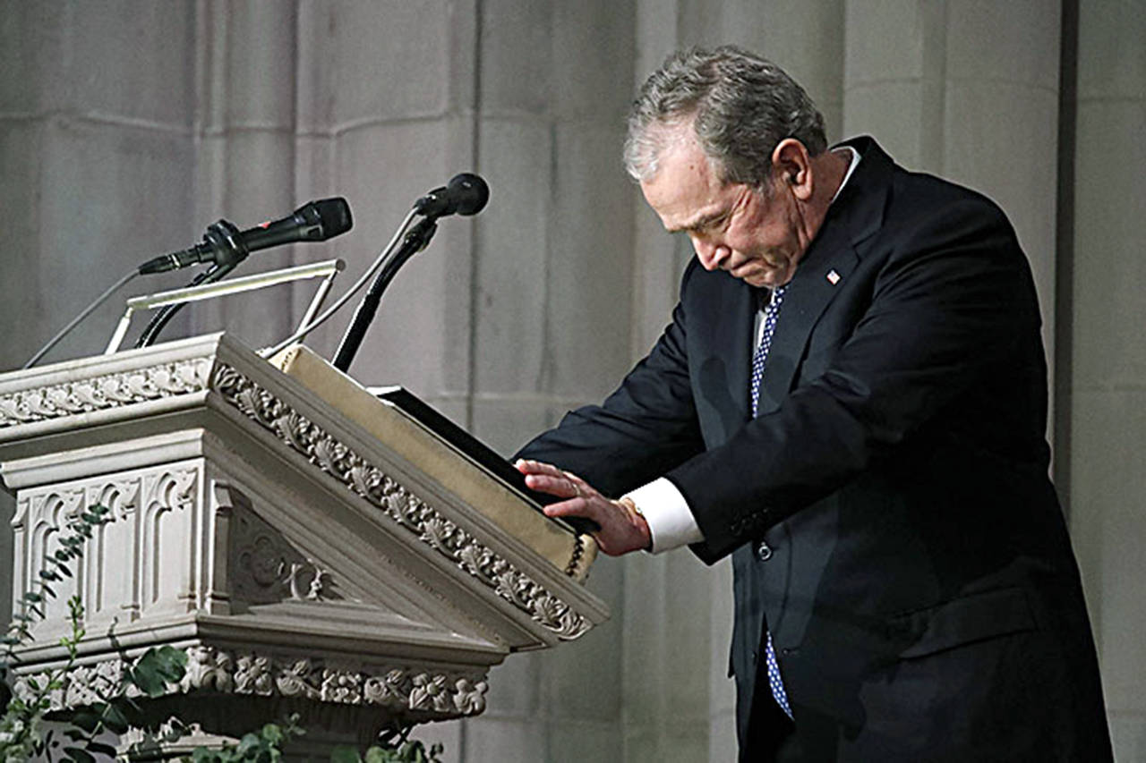 Former President George W. Bush pauses as he speaks at the state funeral for his father, former President George H.W. Bush, at the National Cathedral in Washington on Wednesday. (Alex Brandon/PoolPrensa via ZUMA Wire)