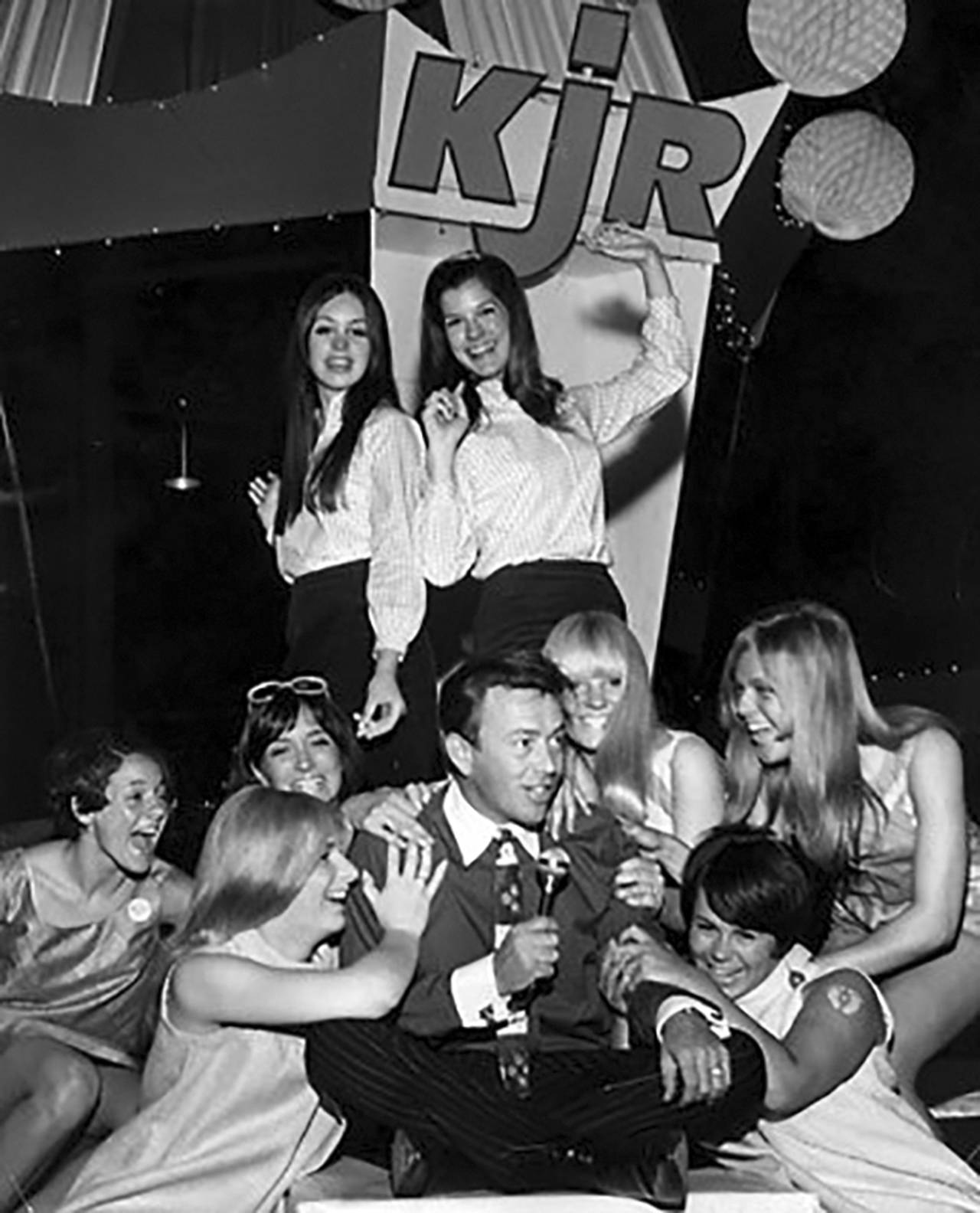 (Pat O’Day Collection) Pat O’Day surrounded by admirers at a dance party in the 1960s.