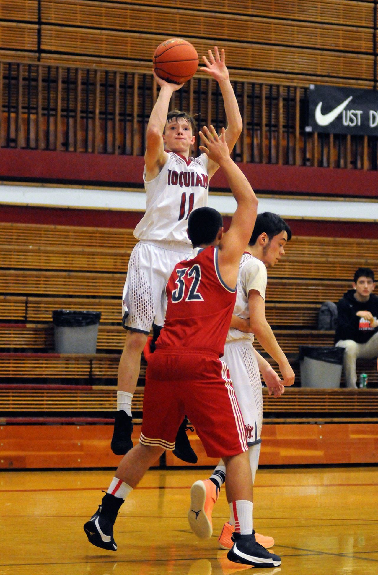 Hoquiam’s Cameron Bumstead (11) rises for a jump shot during the Grizzlies’ overtime loss to Castle Rock on Tuesday in Hoquiam. (Ryan Sparks | Grays Harbor News Group)