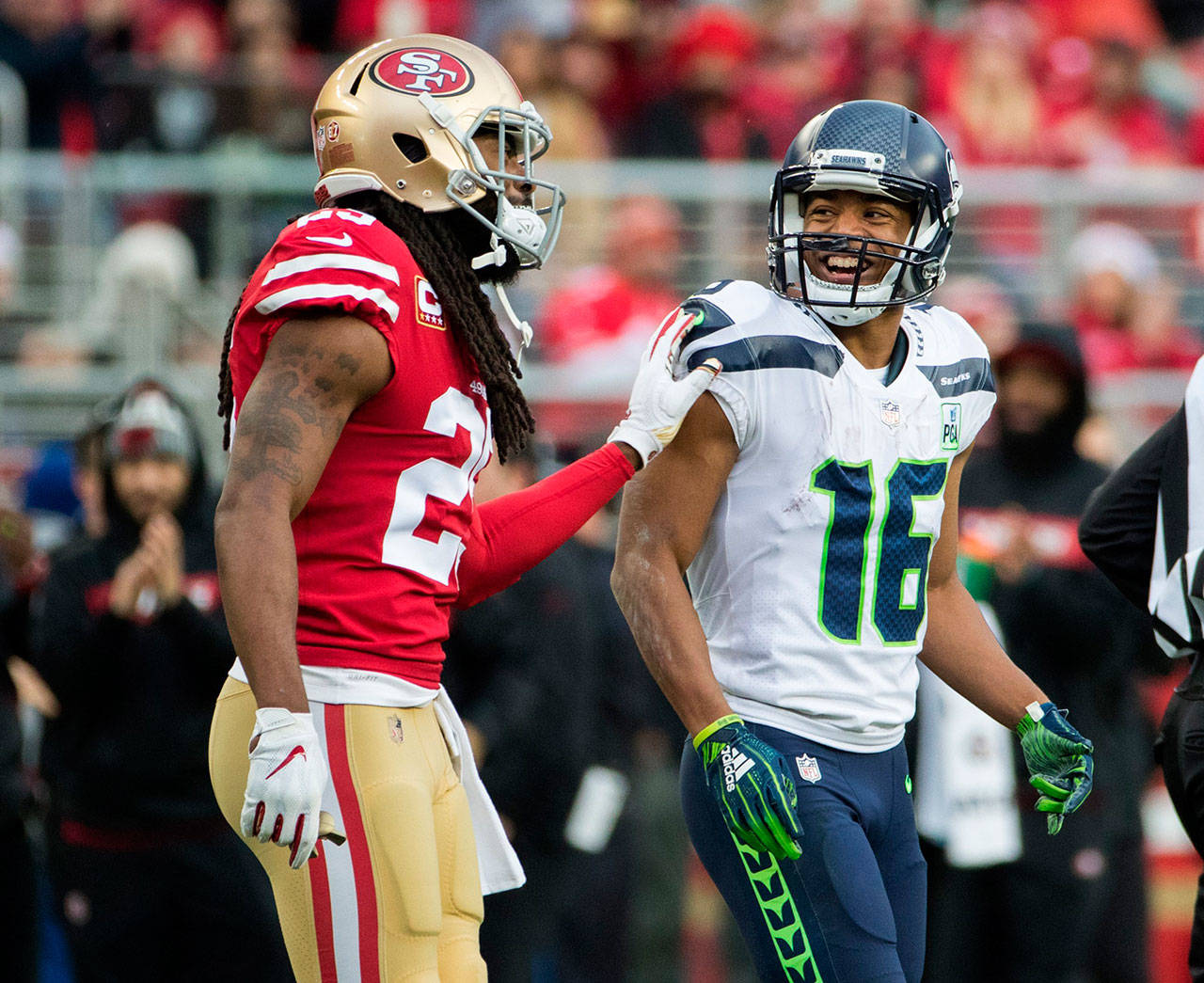 San Francisco 49ers cornerback Richard Sherman (25) and Seattle Seahawks wide receiver Tyler Lockett (16) share a moment on the field during first quarter action on Sunday, Dec. 16, 2018 at Levi’s Stadium in Santa Clara, Calif. (Mike Siegel/Seattle Times/TNS)