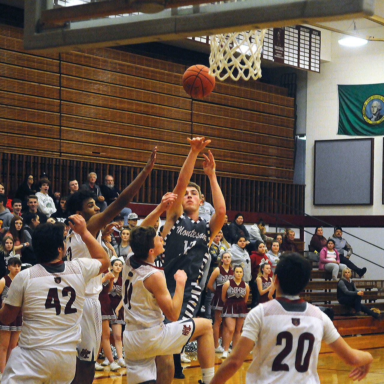 Montesano’s Sam Winter takes a contested mid-range jumper in the first quarter against Hoquiam on Wednesday. Winter scored a game-high 22 points in Montesano’s 57-56 loss to Hoquiam. (Hasani Grayson | Grays Harbor News Group)