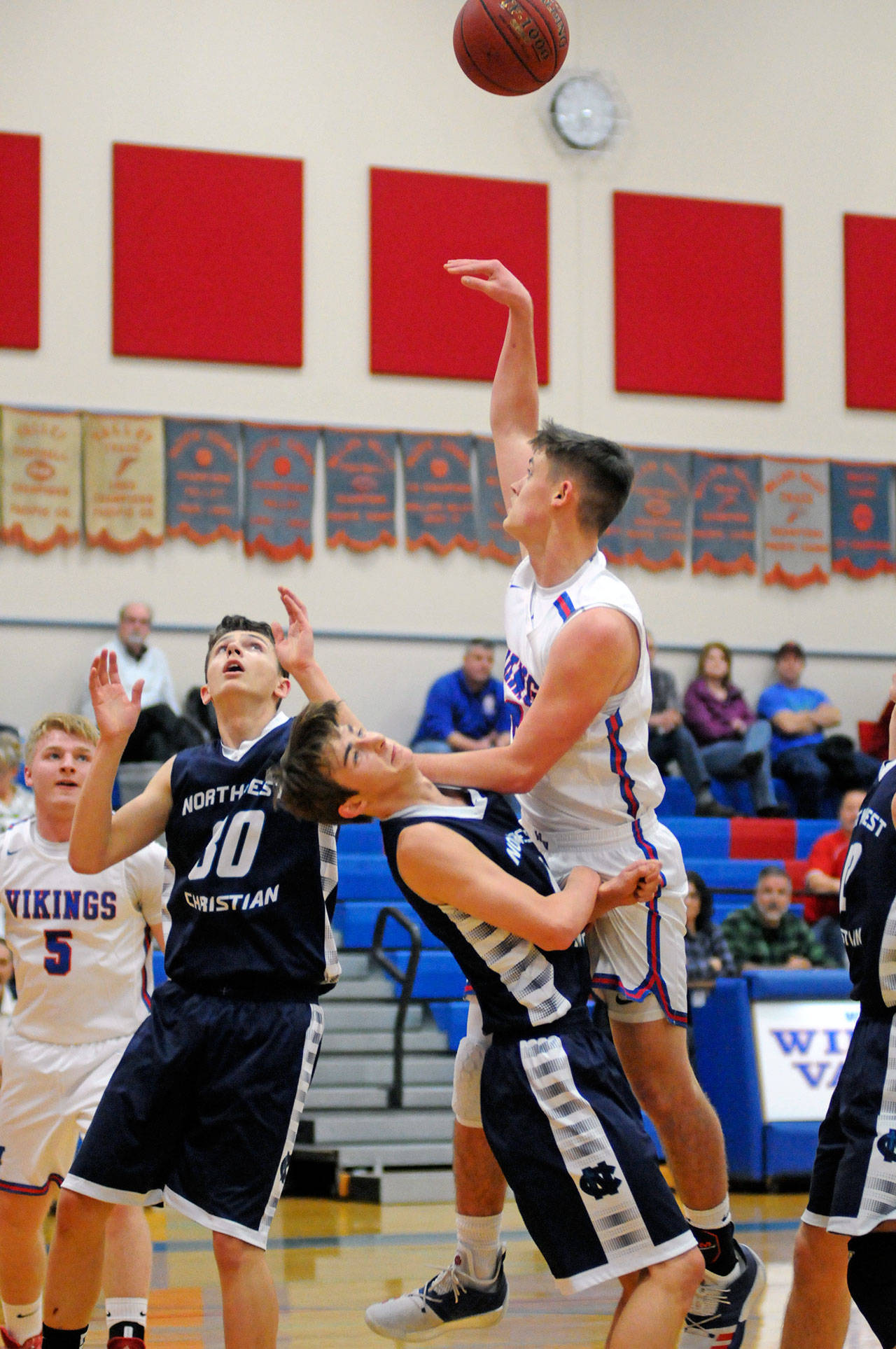 Willapa Valley’s Matt Pearson, right, gets called for a charge against Northwest Christian’s Tyler Fox during the Vikings’ 60-51 loss on Thursday in Menlo. (Ryan Sparks | Grays Harbor News Group)